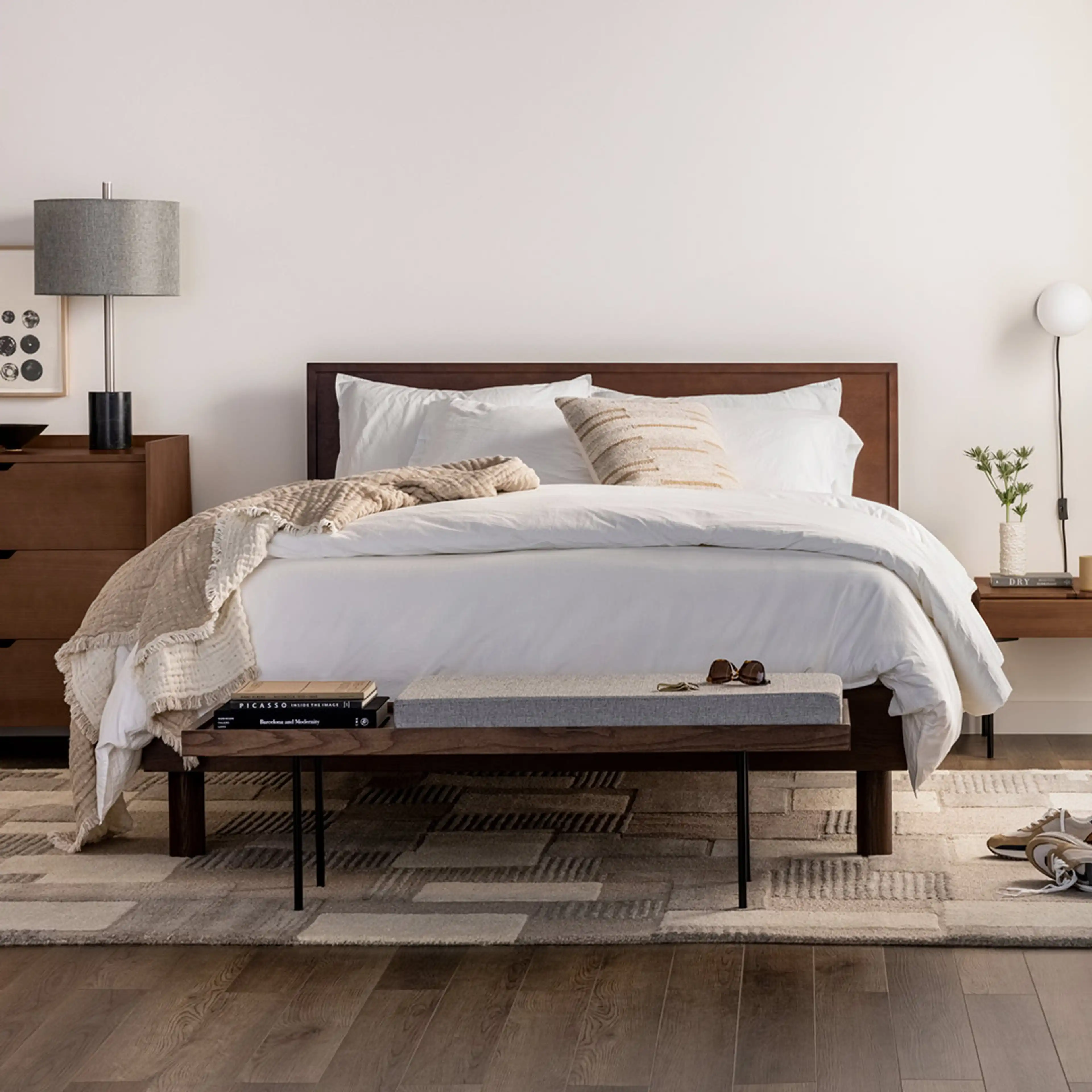 Peaceful bedroom with a Chorus walnut bedframe and spacious Great Plains area rug