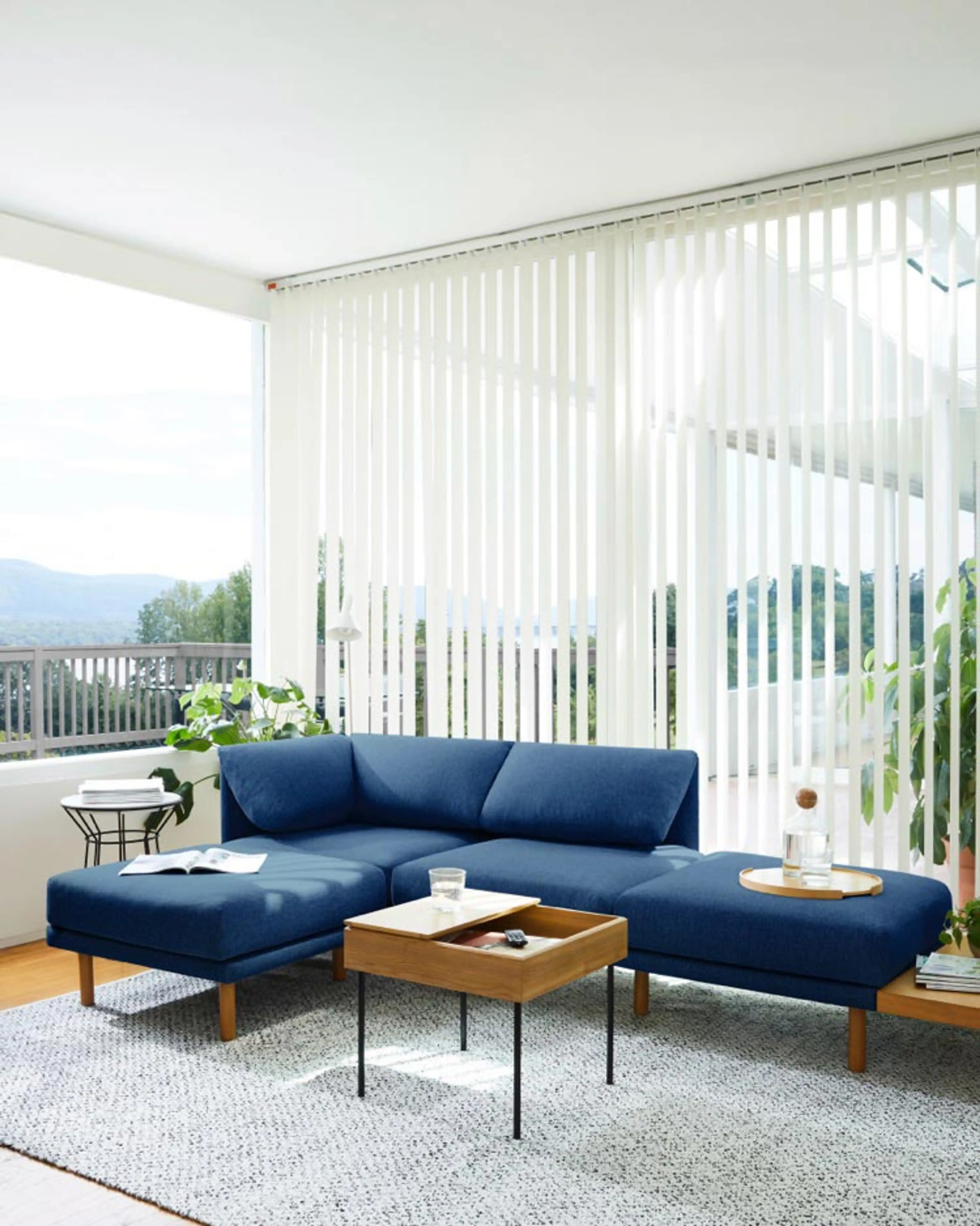 Range sectional in navy blue lighting up a modern living room