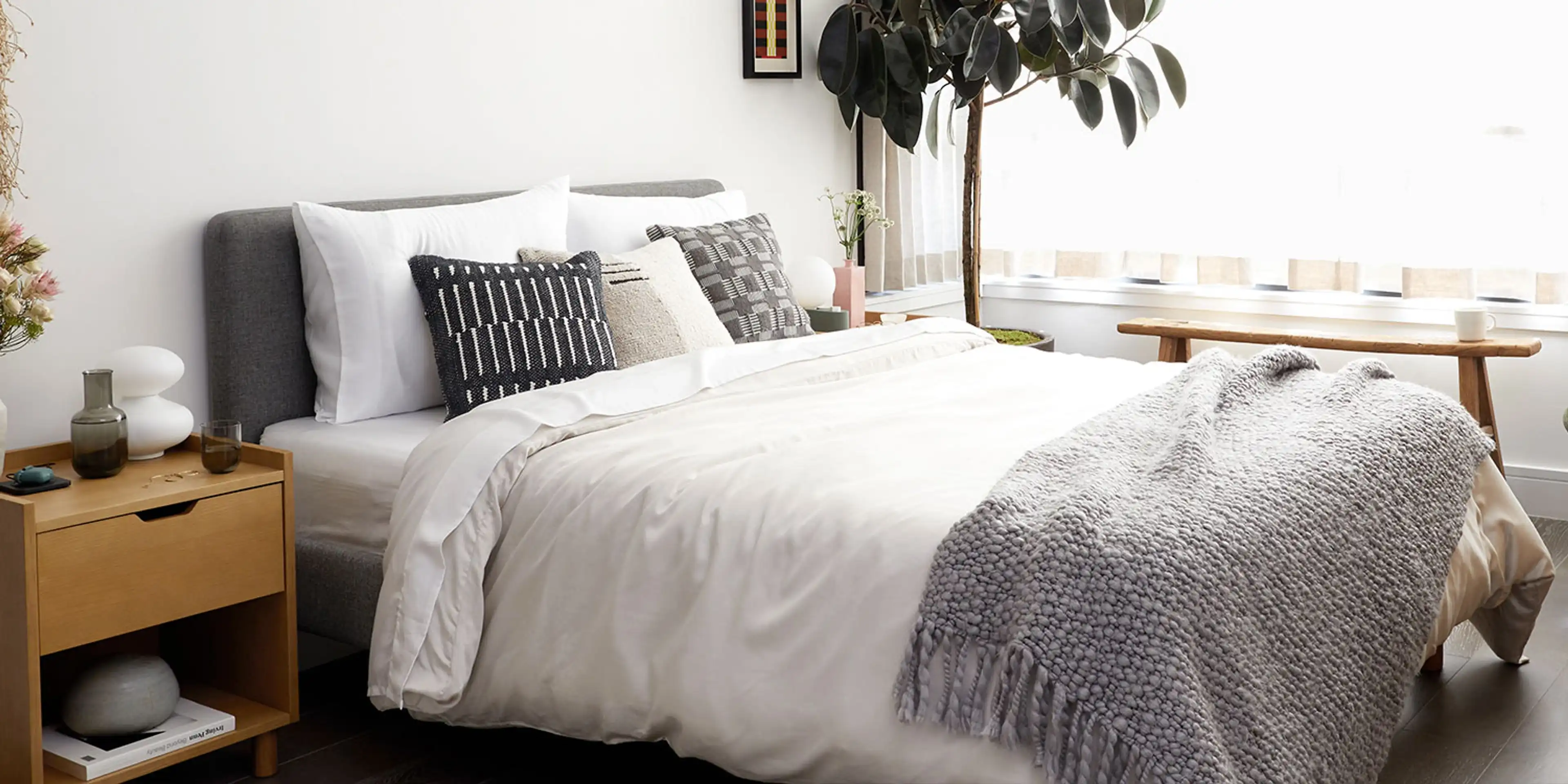 Chorus upholstered frame and headboard, with an accompanying oak nightstand