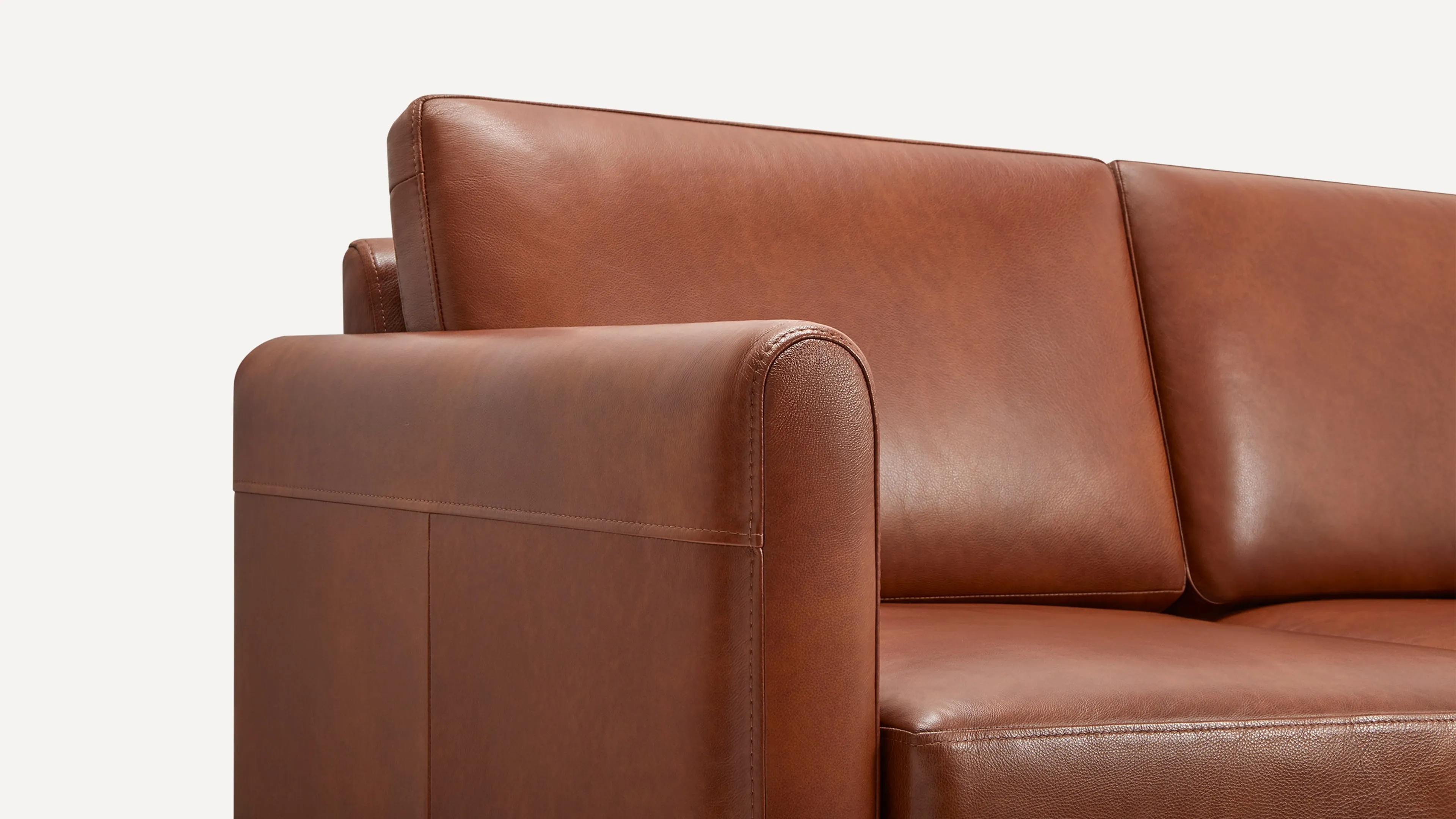 The Nomad Leather Loveseat with Chaise with Ottoman Burrow