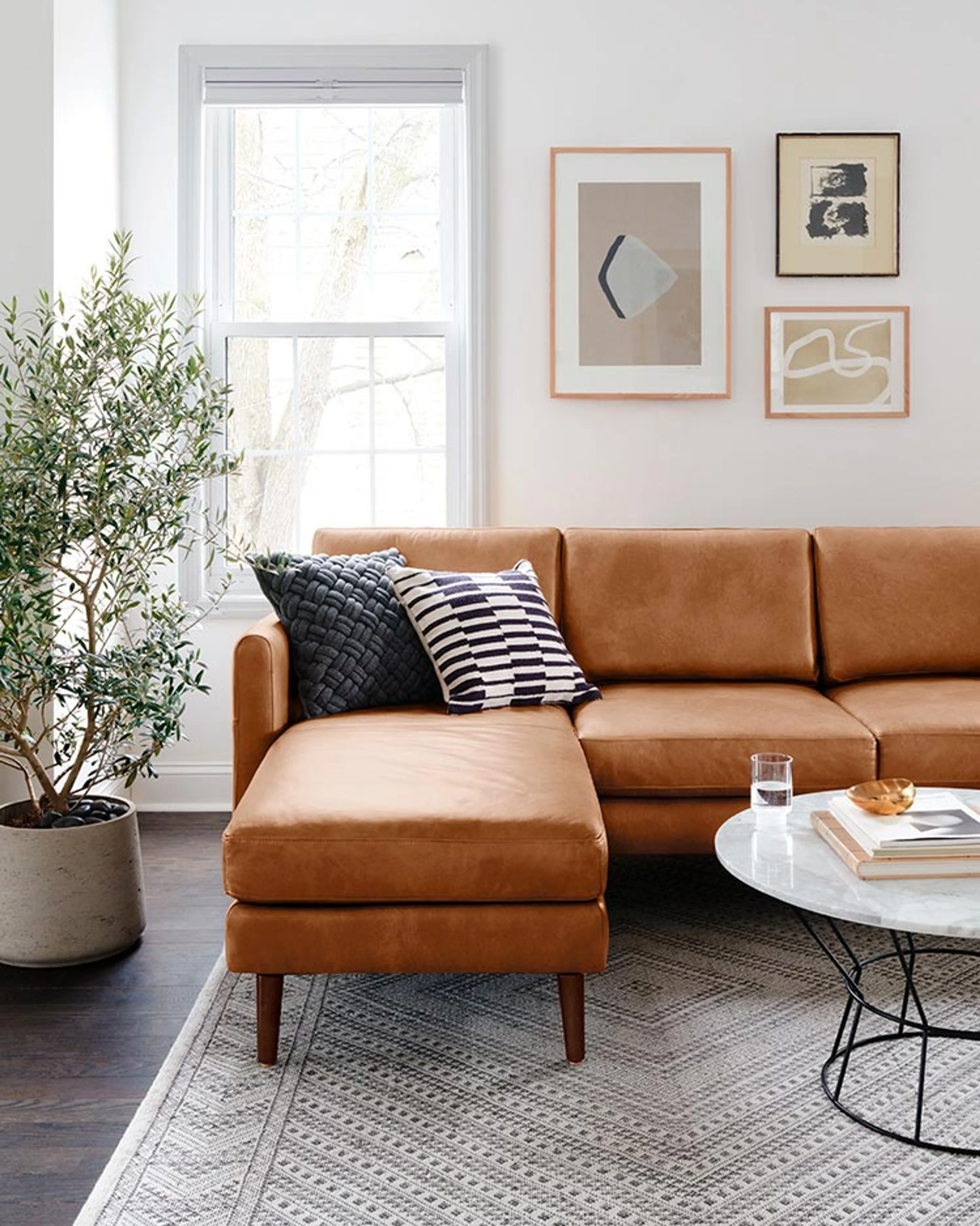 Suburban home living room with Nomad leather double chaise sofa