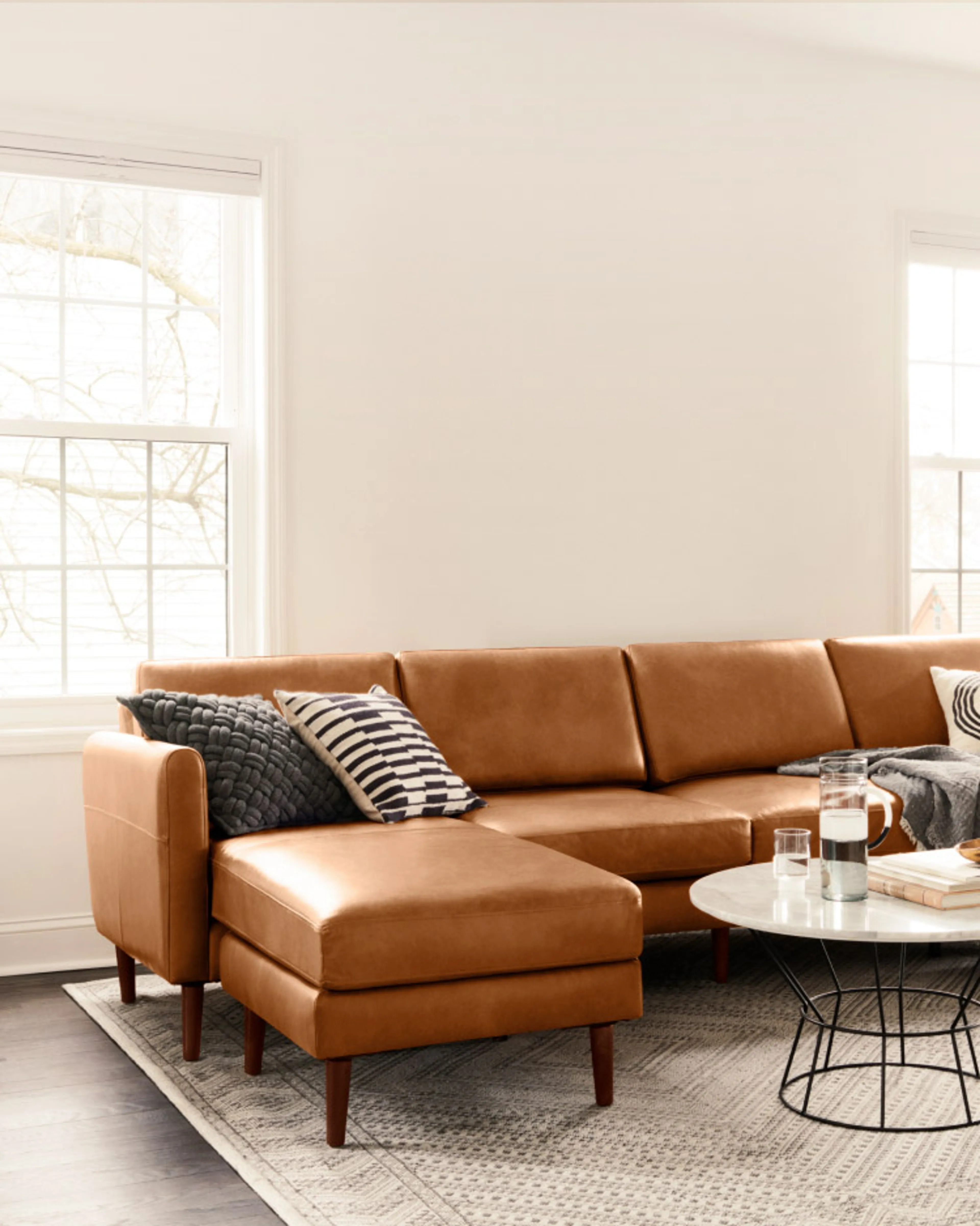 Nomad Leather Sofa in Chestnut looking like a cozy place to relax