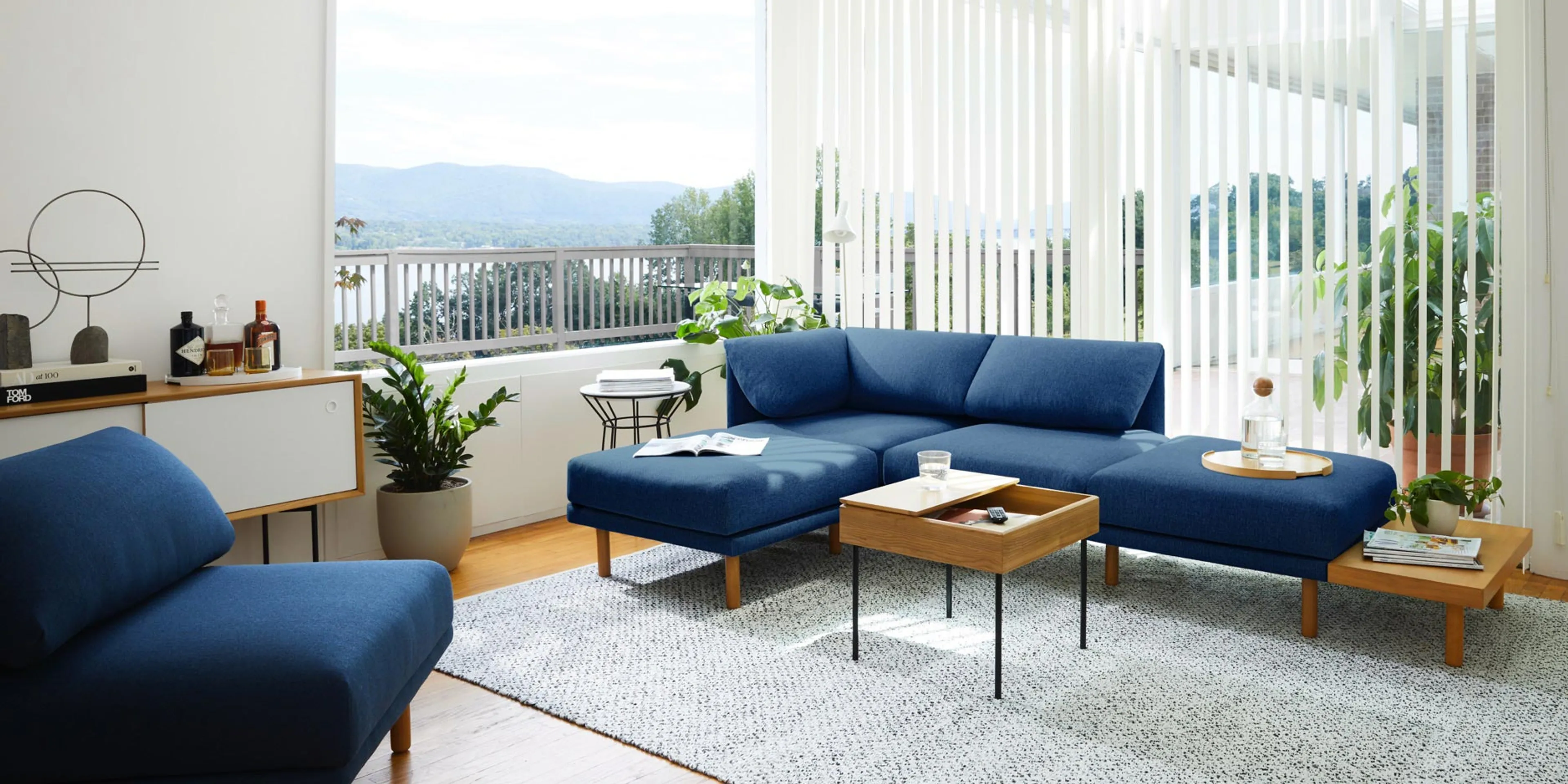 Range sectional in navy blue lighting up a modern living room