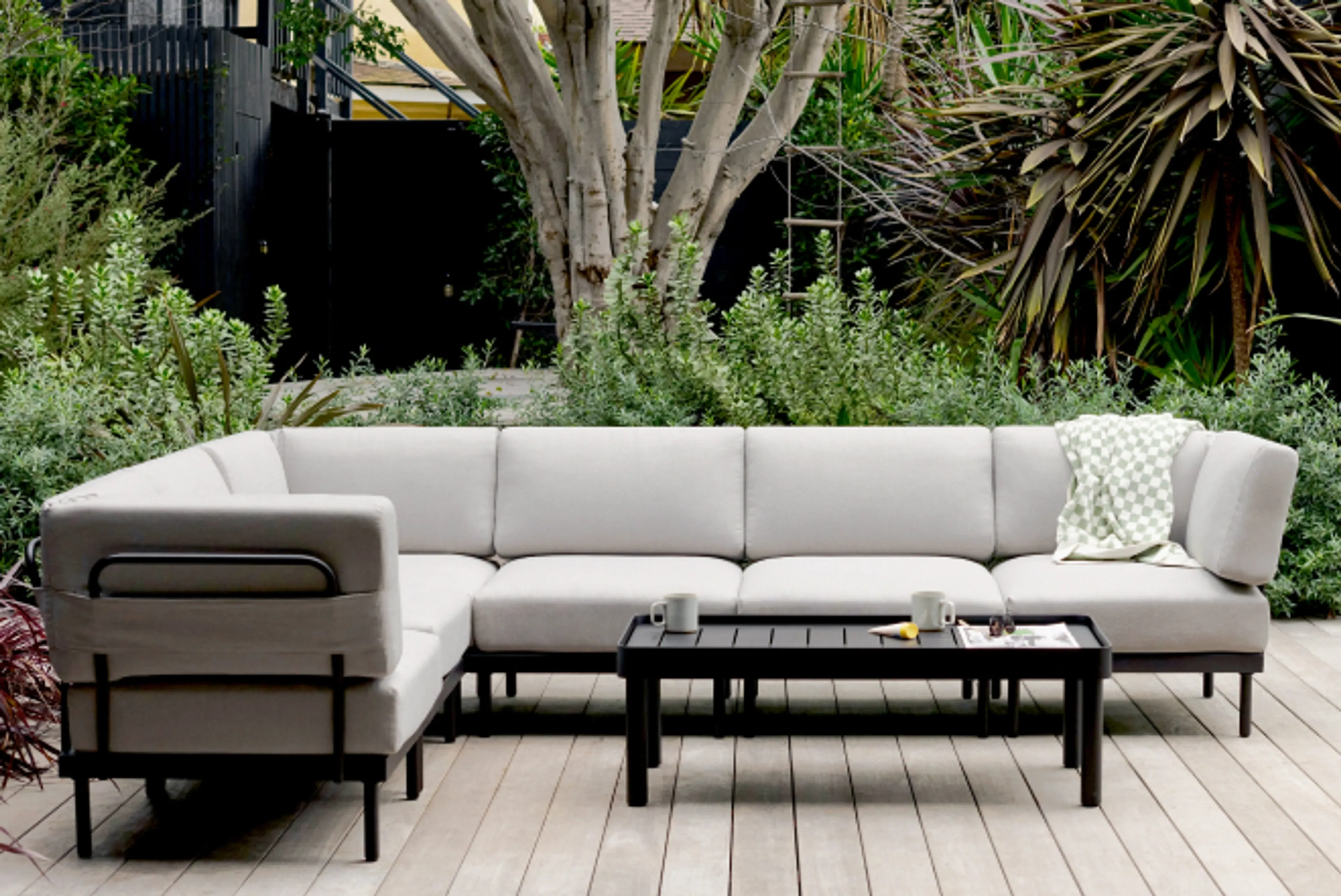 Relay sofa with coffee table in shale shown in outdoor patio setting
