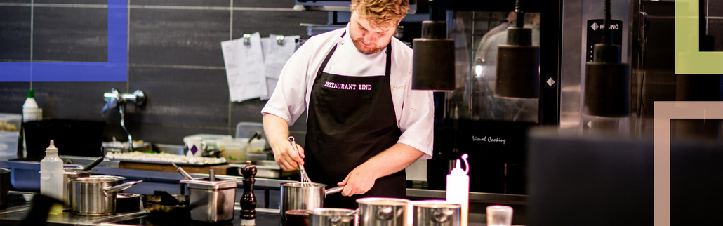 A cook in an modern kitchen