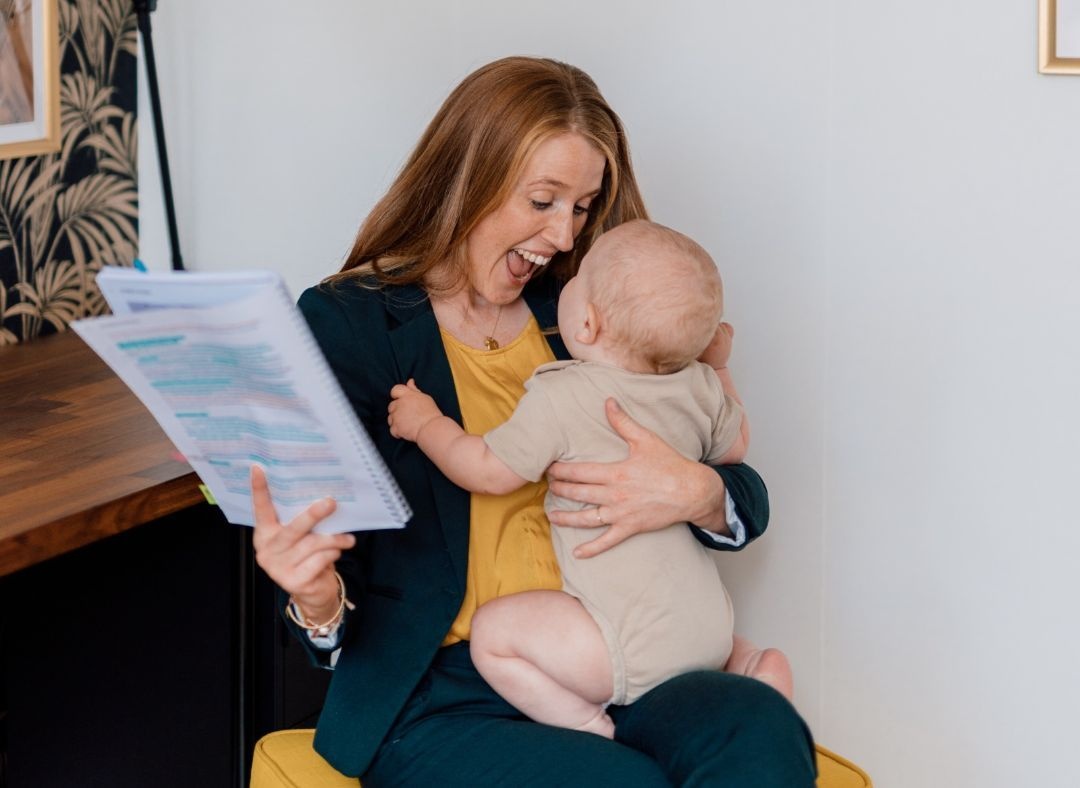 Margaret holding her son Liam, while studying