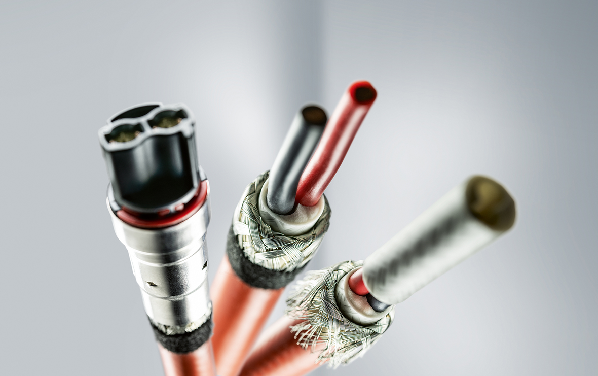 Highvoltage cable assembly From nail scissors and toothbrush method to full automation Komax