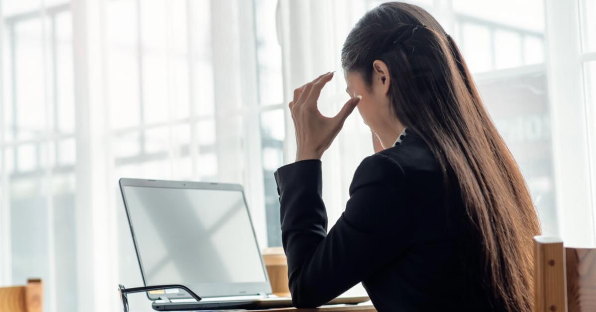 woman stress over workplace bullying