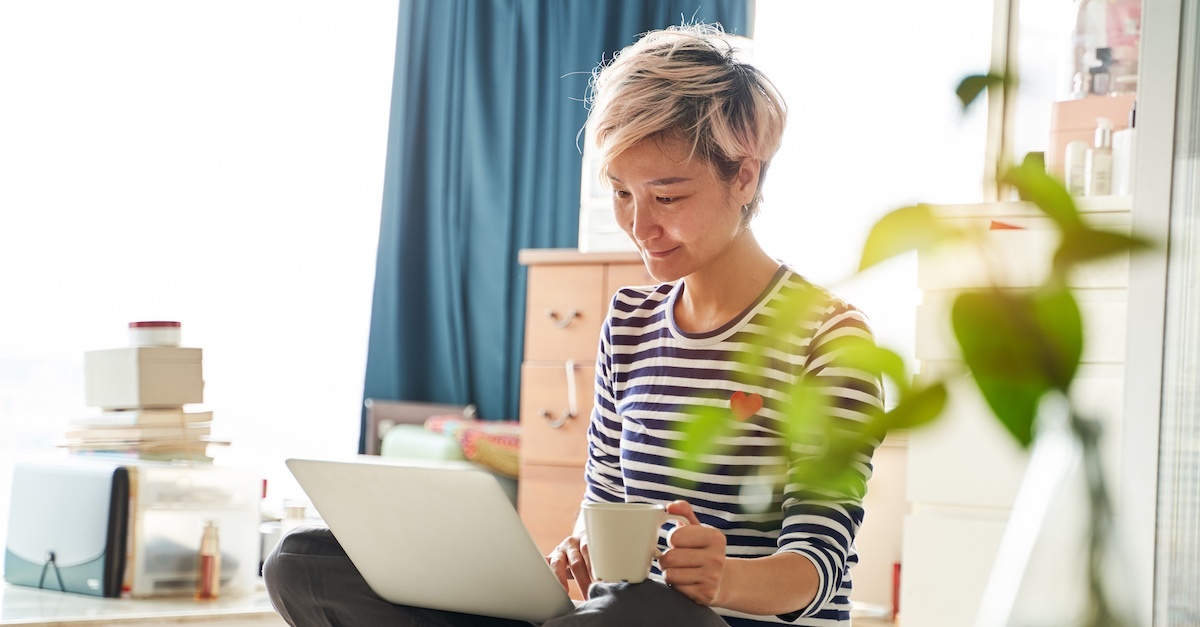 Woman on laptop typing an email