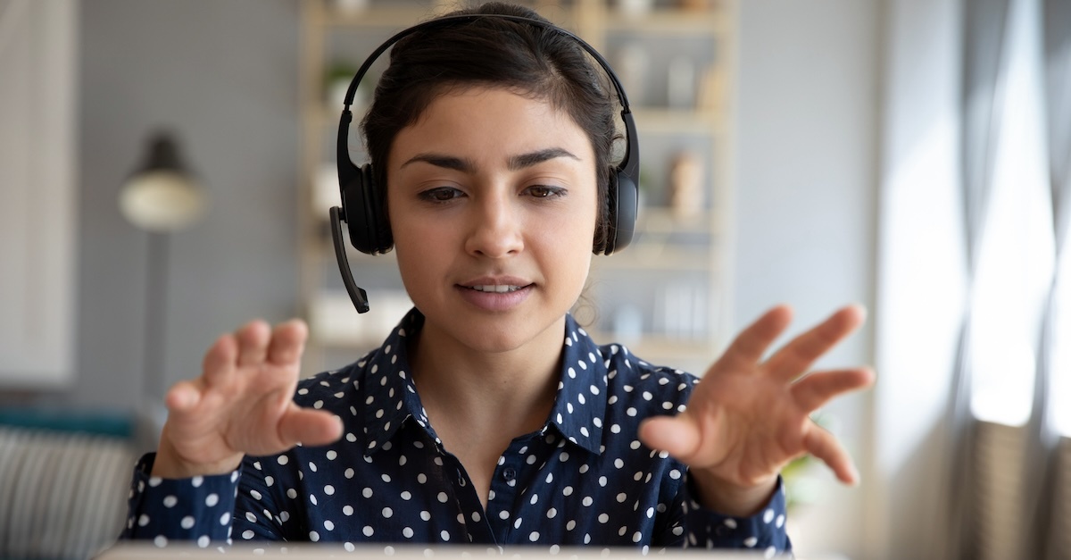 Woman wearing a headset in a virtual interview