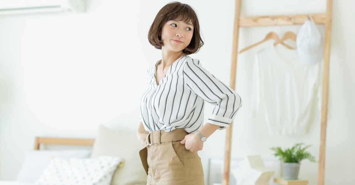 woman wearing business casual khaki pants with long sleeve blouse