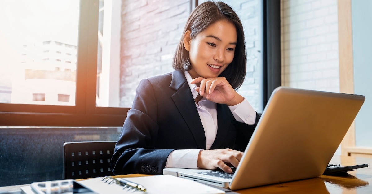 Business woman on laptop at a desk