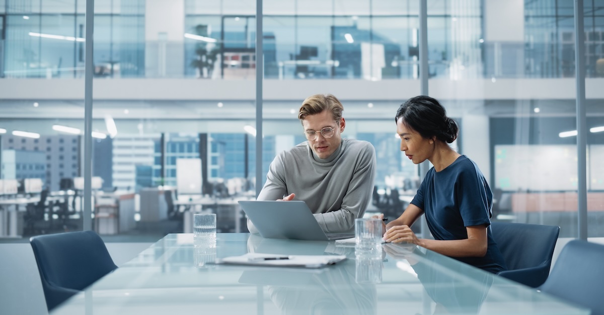 Two employees at a workplace engaged on a discussions