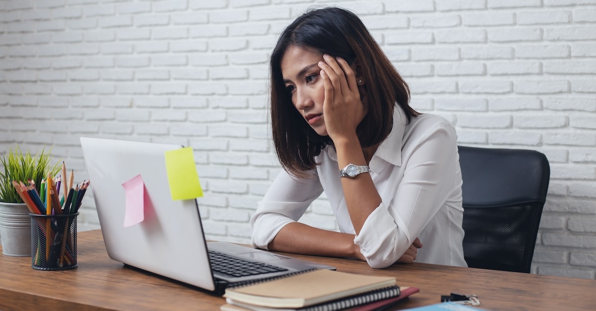 woman at desk with laptop