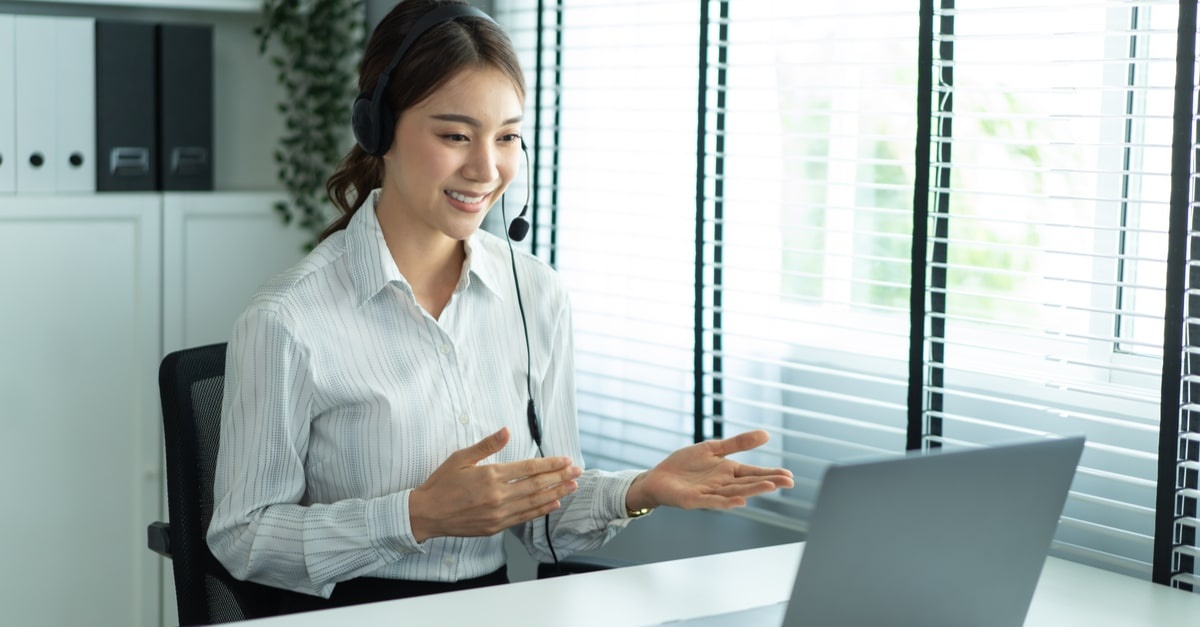 Woman working on her laptop as a customer support agent