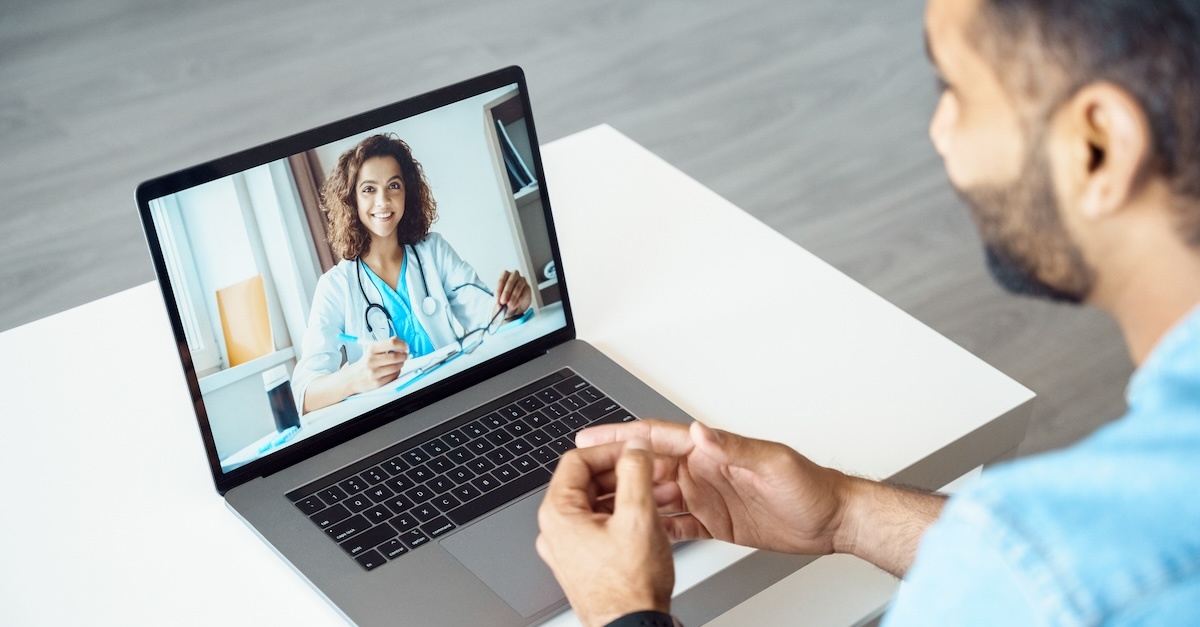 Healthcare professional in a virtual interview on a laptop