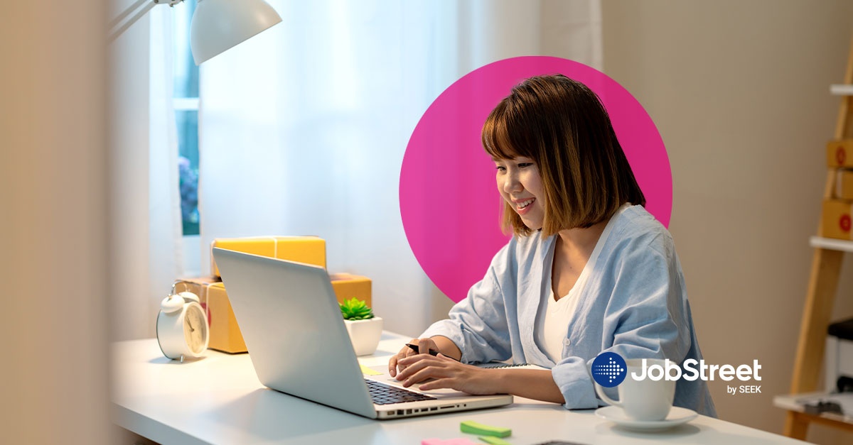 A female employee working from home browsing on her laptop about redundancy