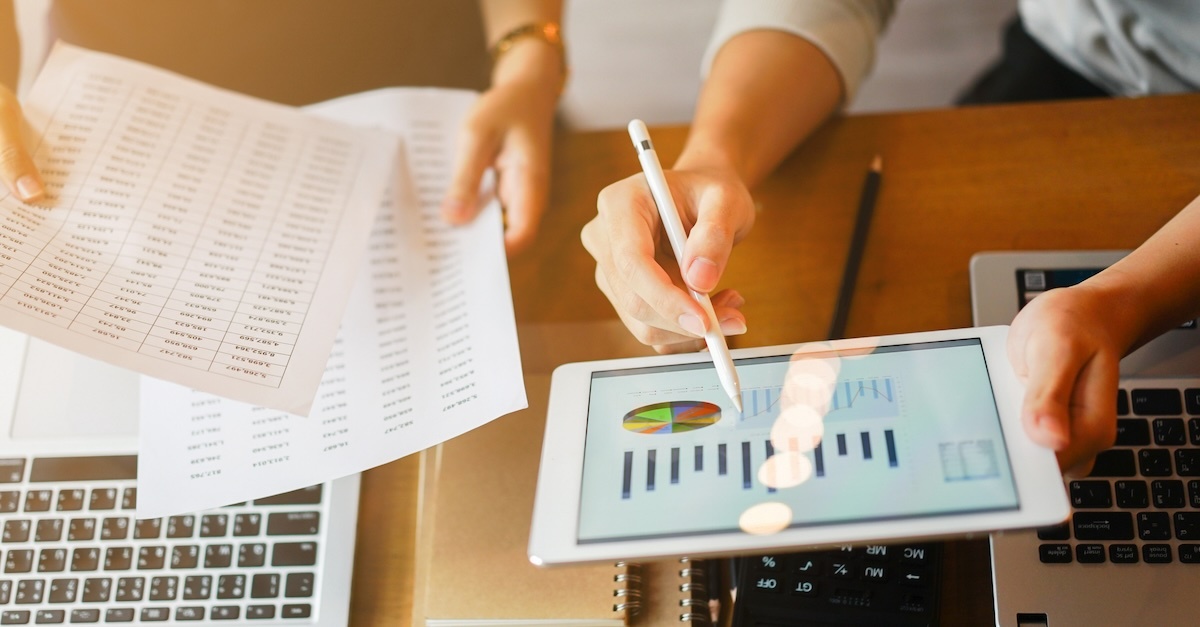 Two people reviewing a report