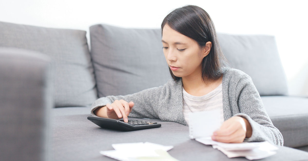 A woman computing her finances