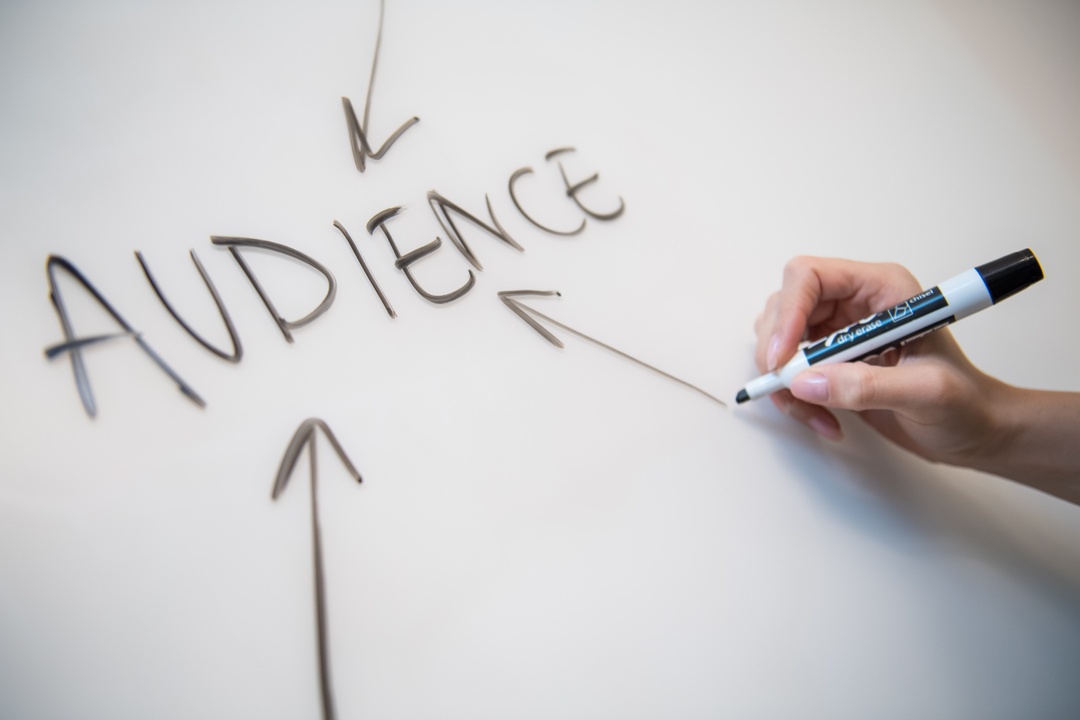 the word audience written on a whiteboard during a staff meeting at SensoriumArte