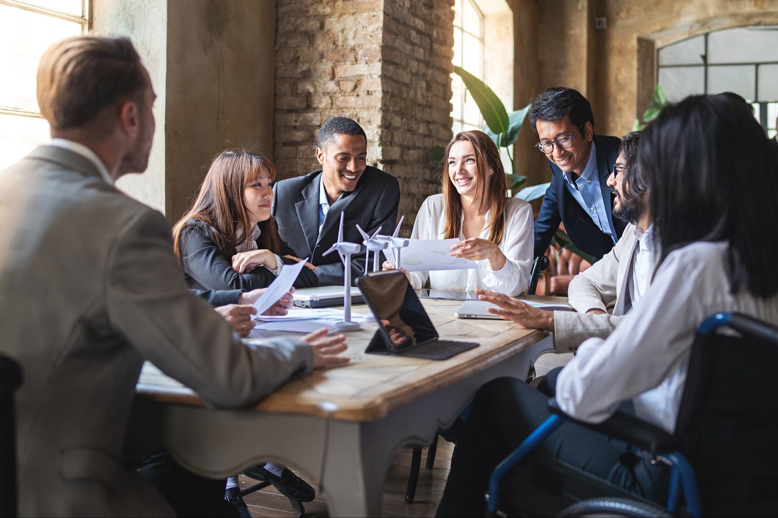 a group of colleagues having a meeting discussion