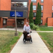 Woman with walker outside building
