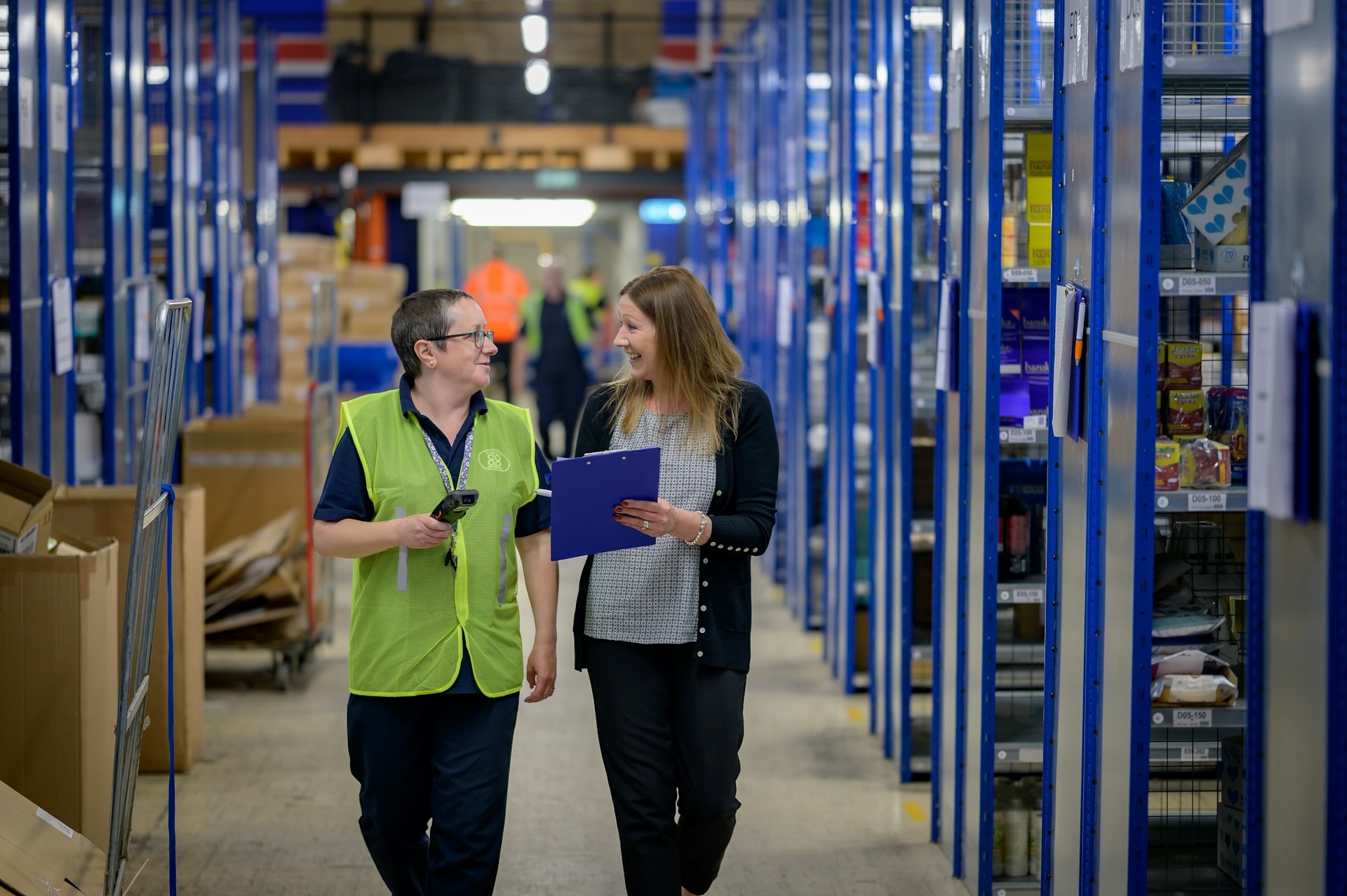 happy warehouse casual worker getting along with her boss