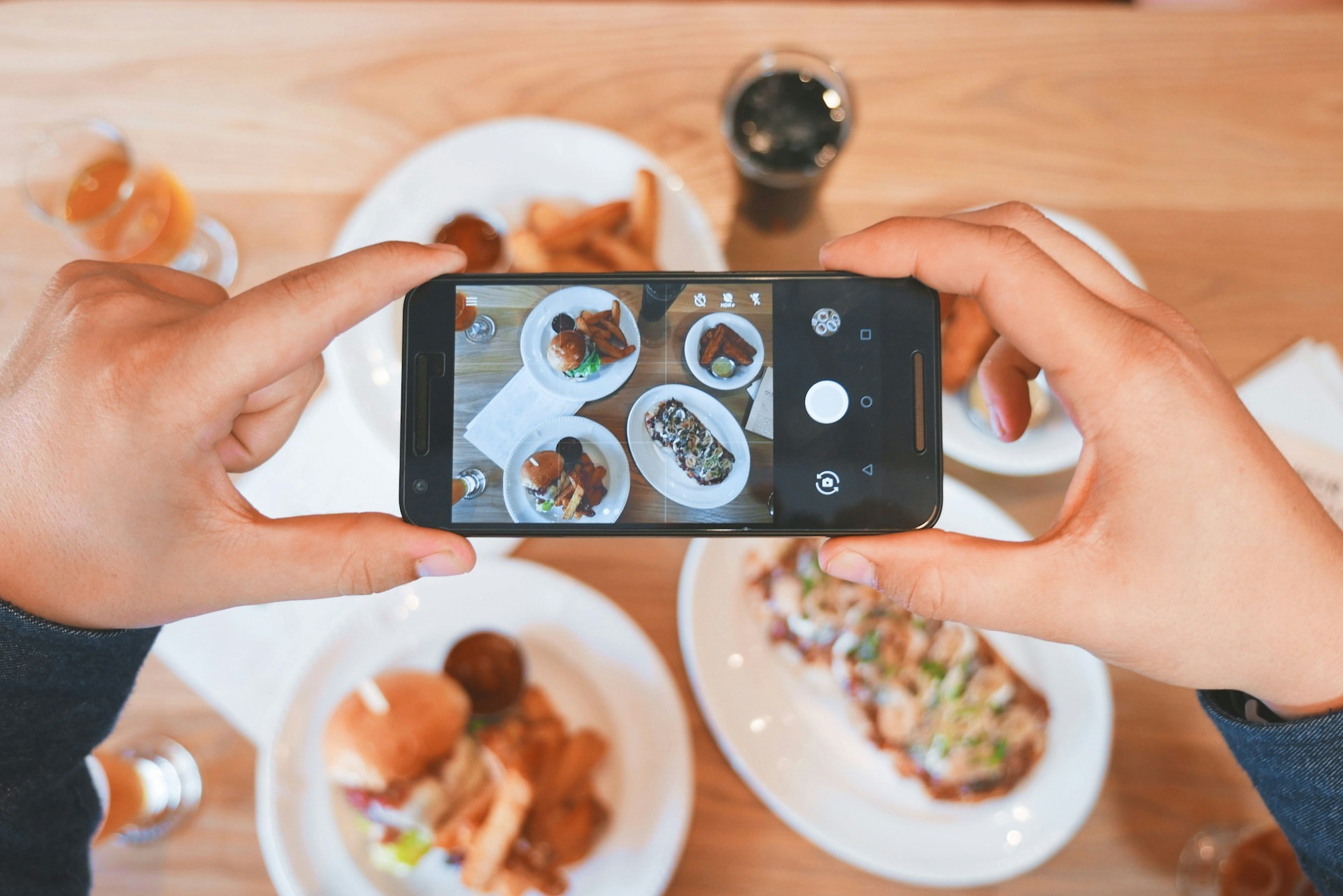 Taking a photo of food for social media