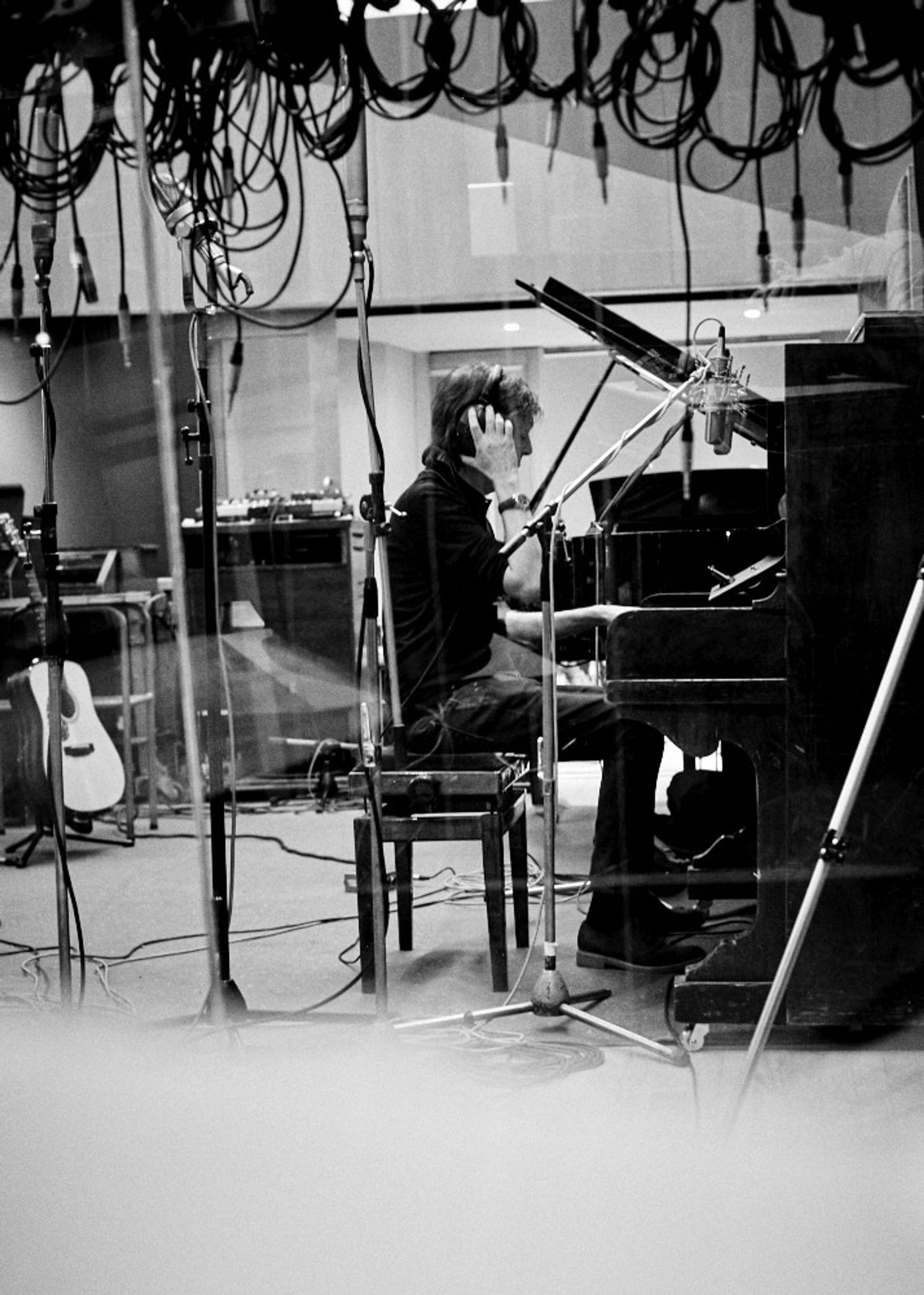 Photo of Paul McCartney at the piano at Abbey Road Studios