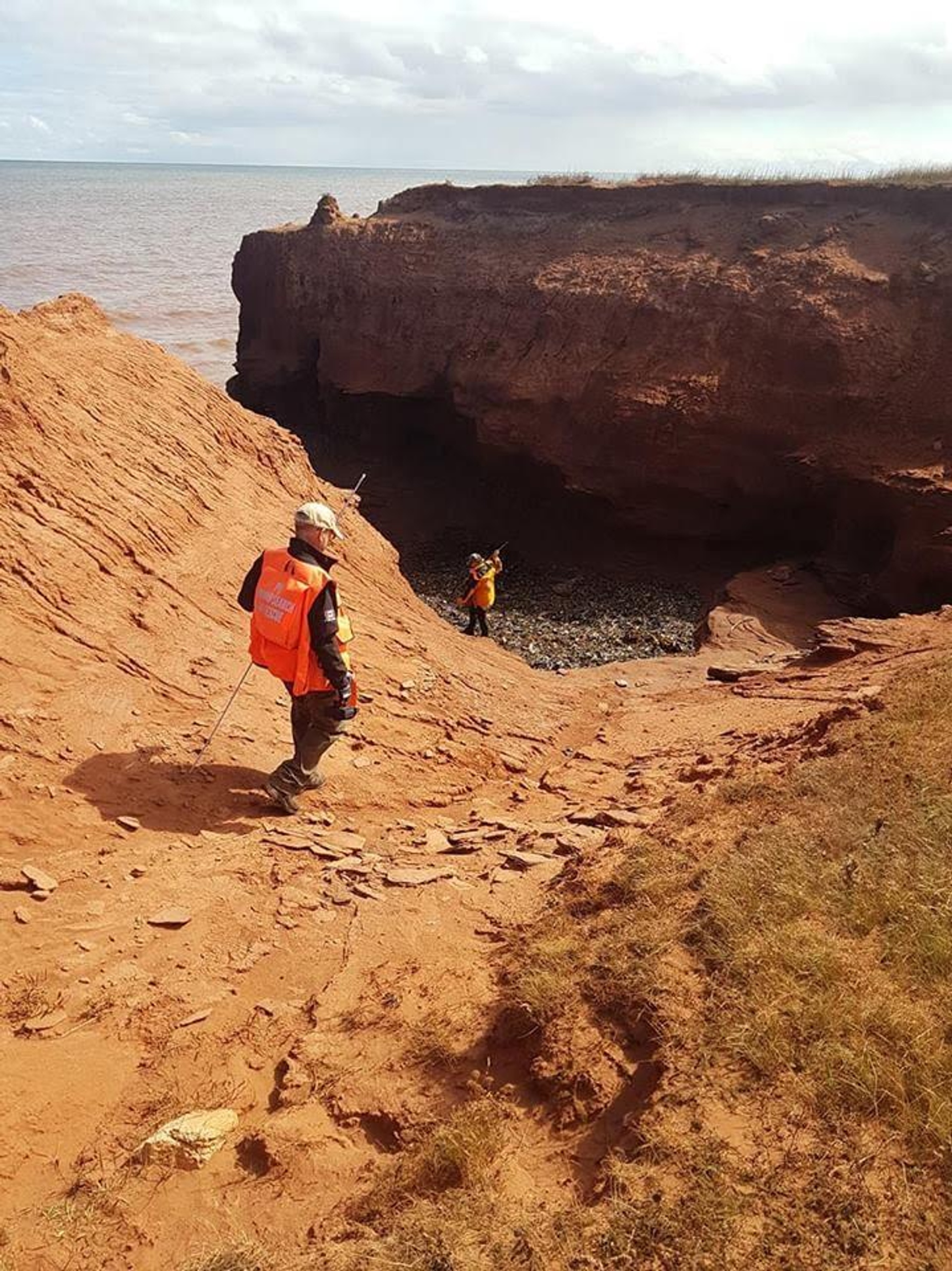 Prince Edward Island Ground Search & Rescue member walking on shore