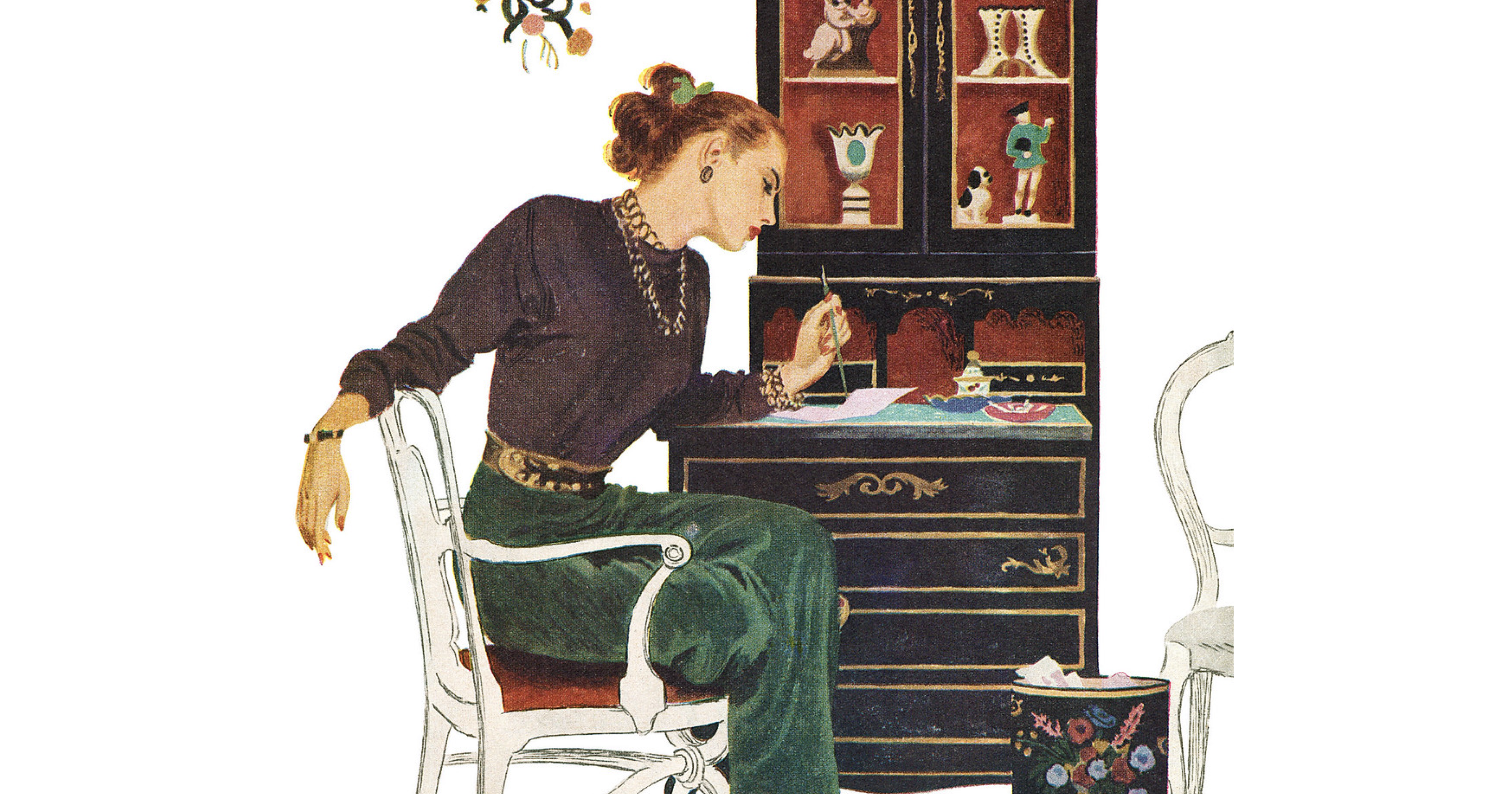 An elegant woman sits at her desk, either writing or making art