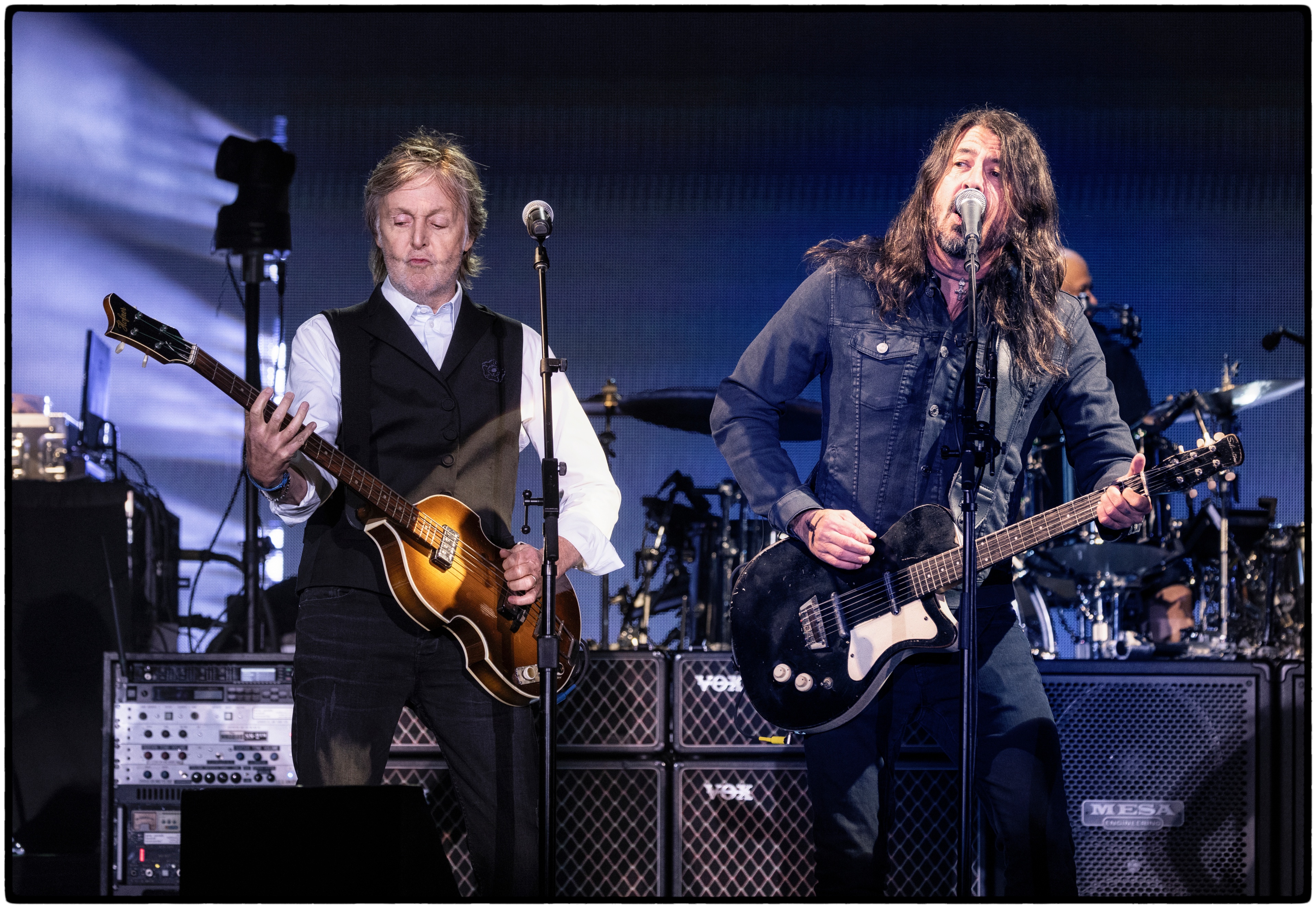Paul plays guitar with Dave Grohl on stage at Glastonbury