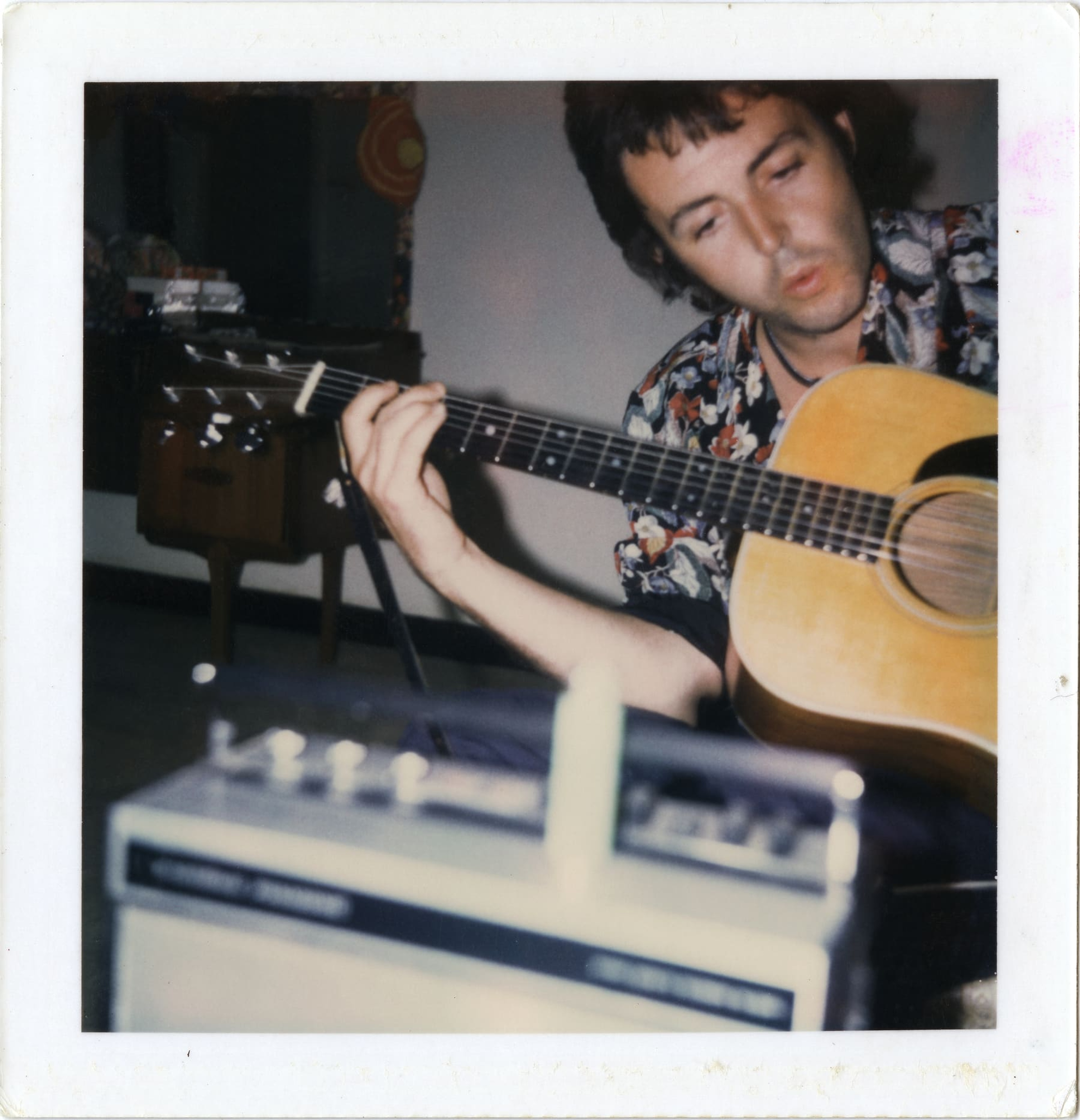 Polaroid of Paul playing the guitar during the Band on the Run recording sessions.
