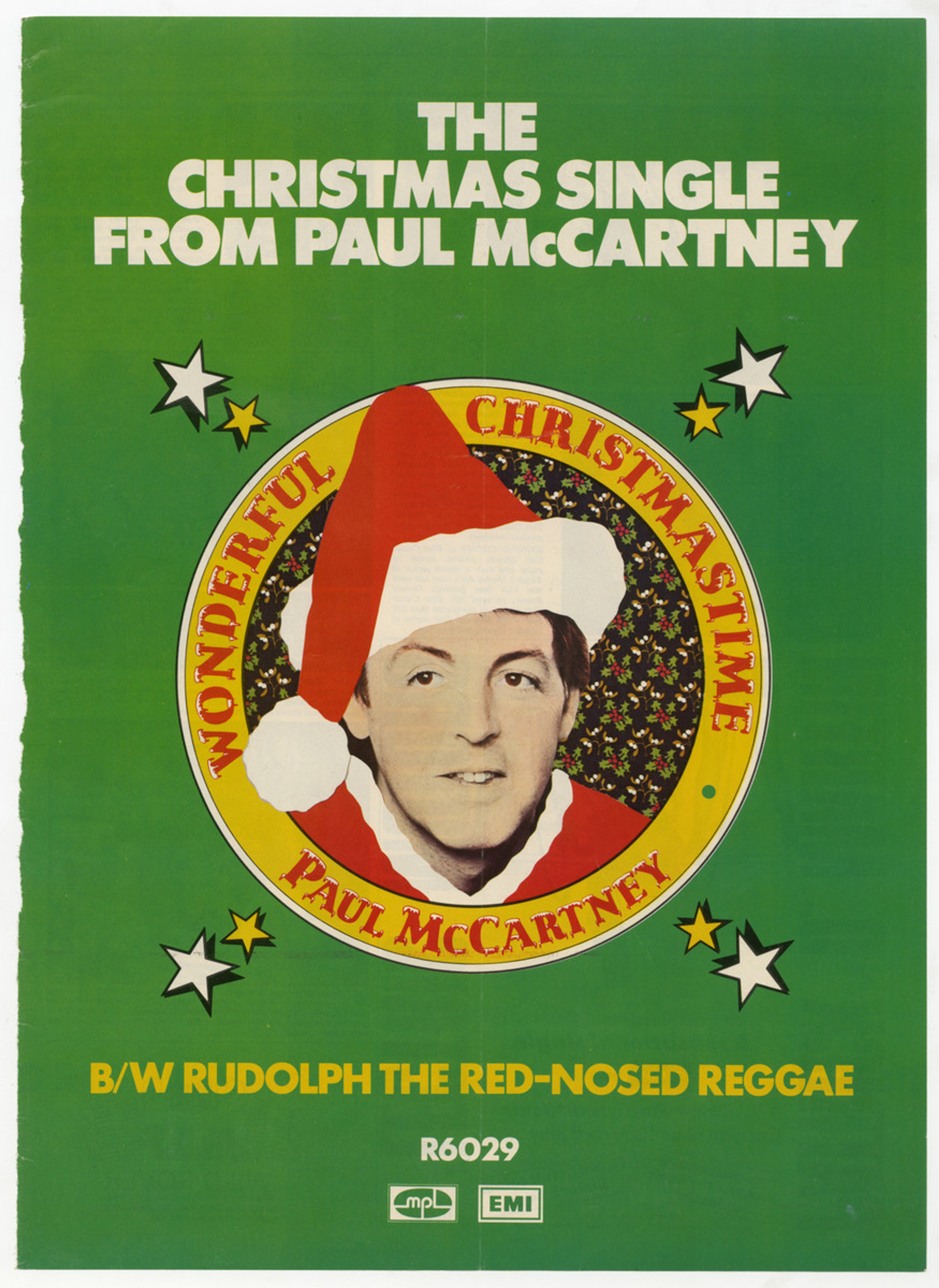 Green poster featuring Paul wearing a Santa hat