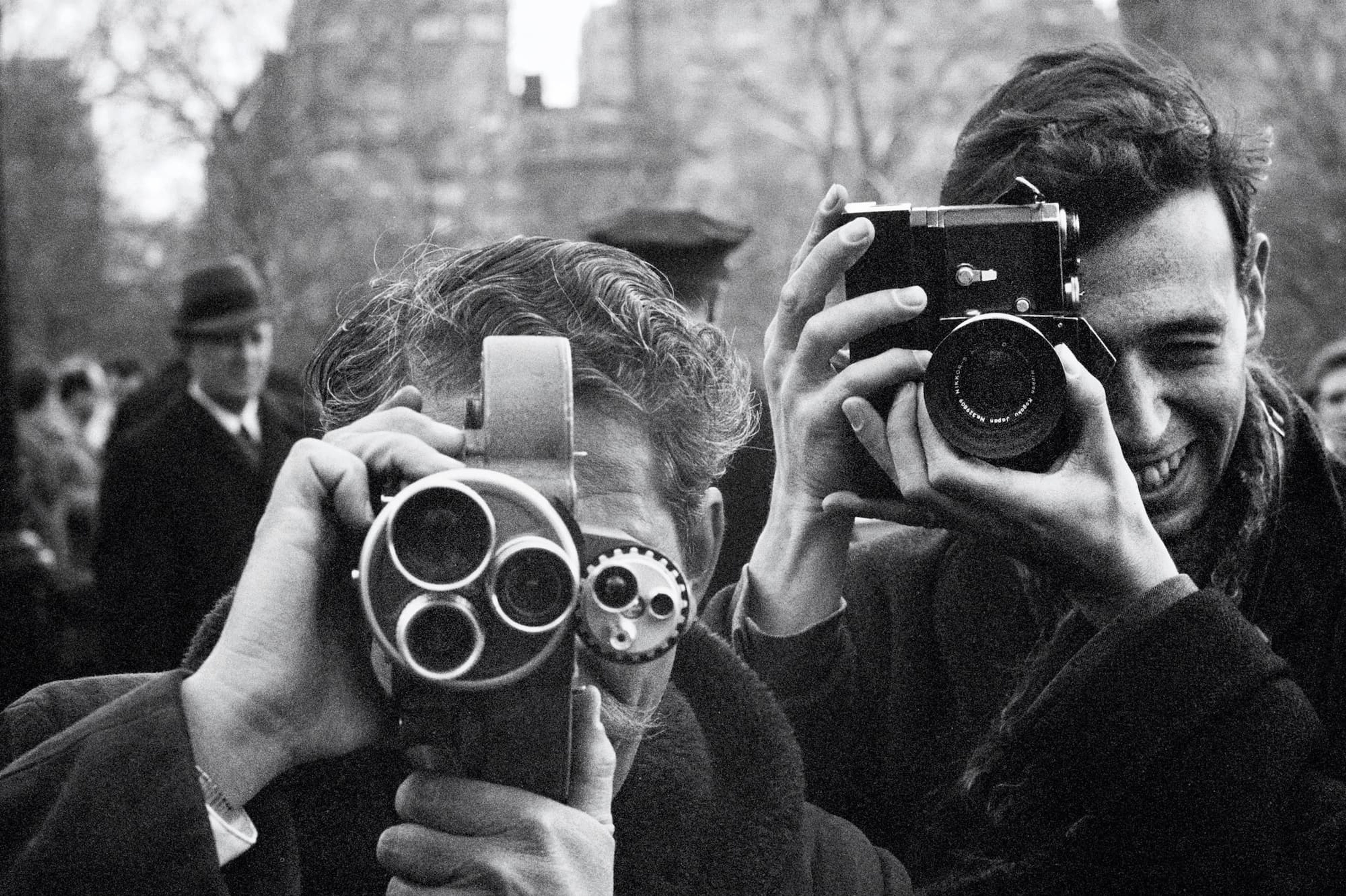Black and white photograph taken by Paul McCartney of press photographers