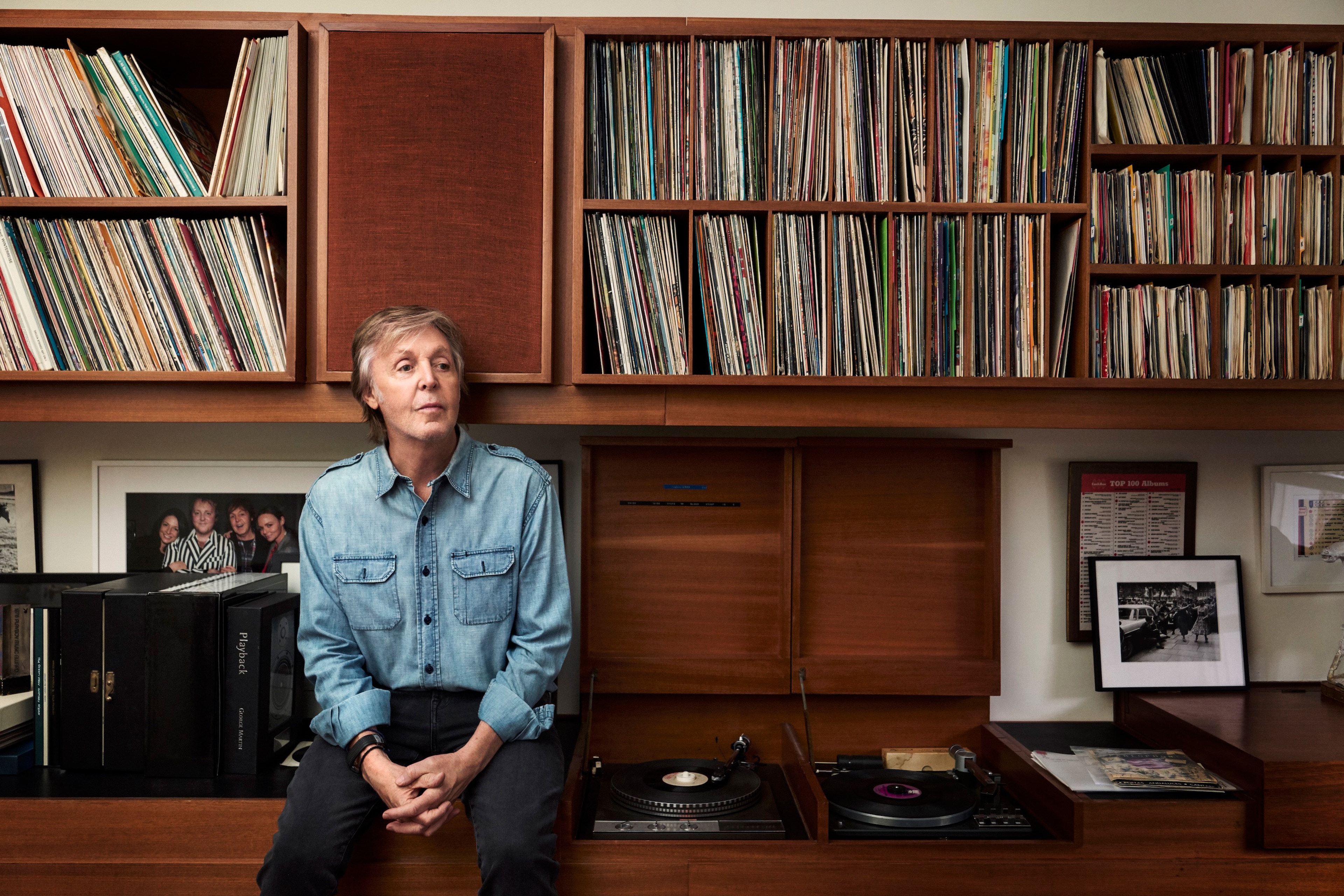 Photo of Paul at home infant of a record player looking up to the right