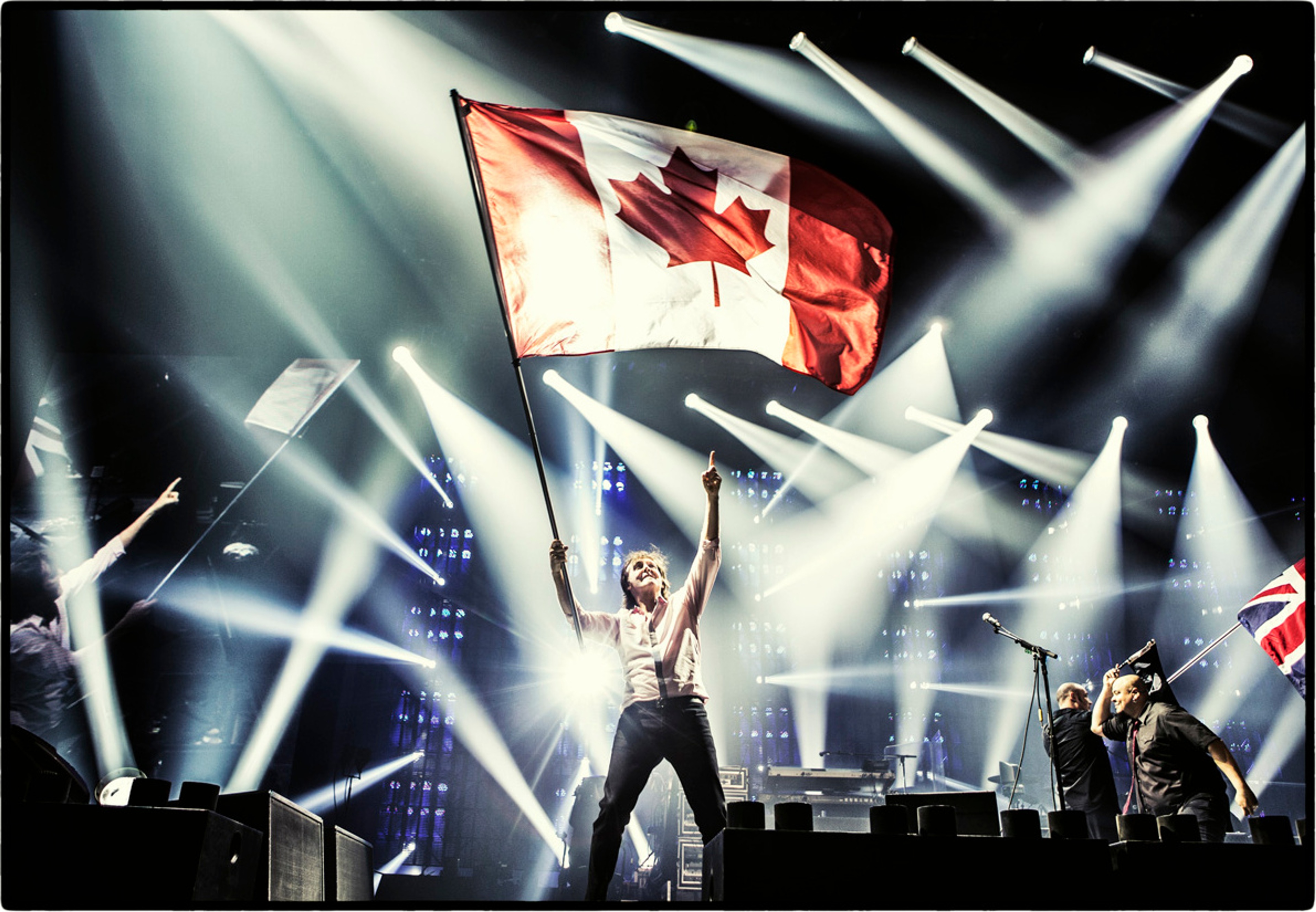 Paul waving the Canadian flag on stage, Scotiabank Place, Ottawa, 13th June 2013