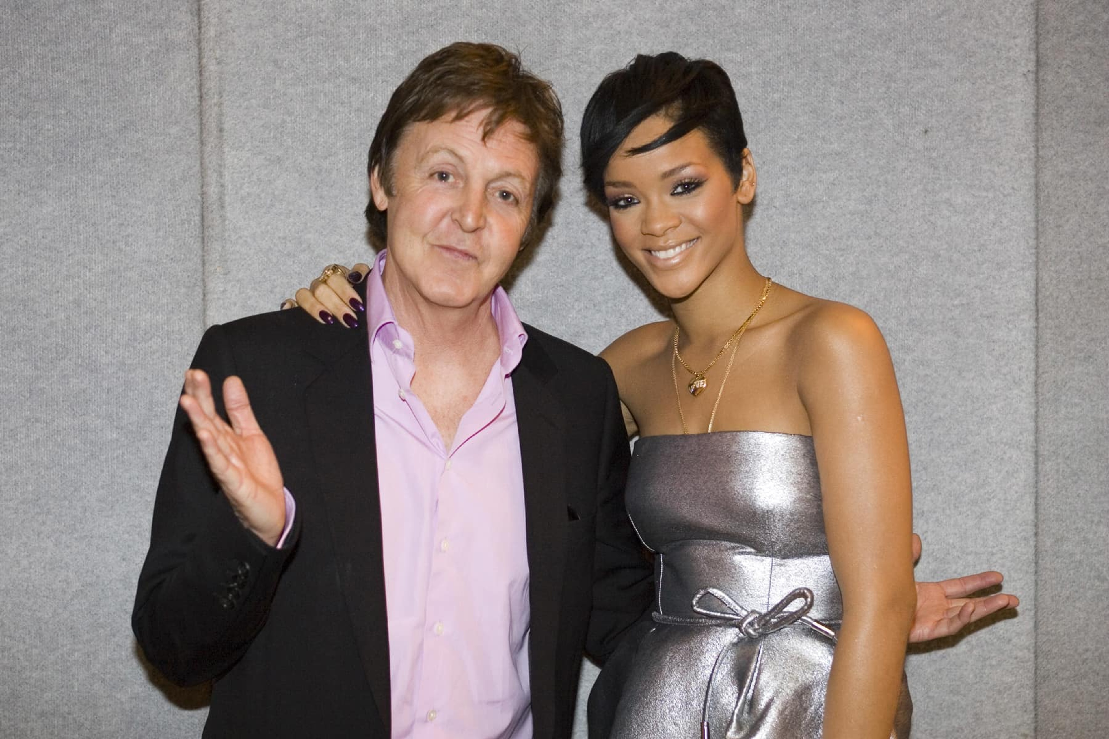 Paul poses with Rihanna at the 2008 Brit Awards