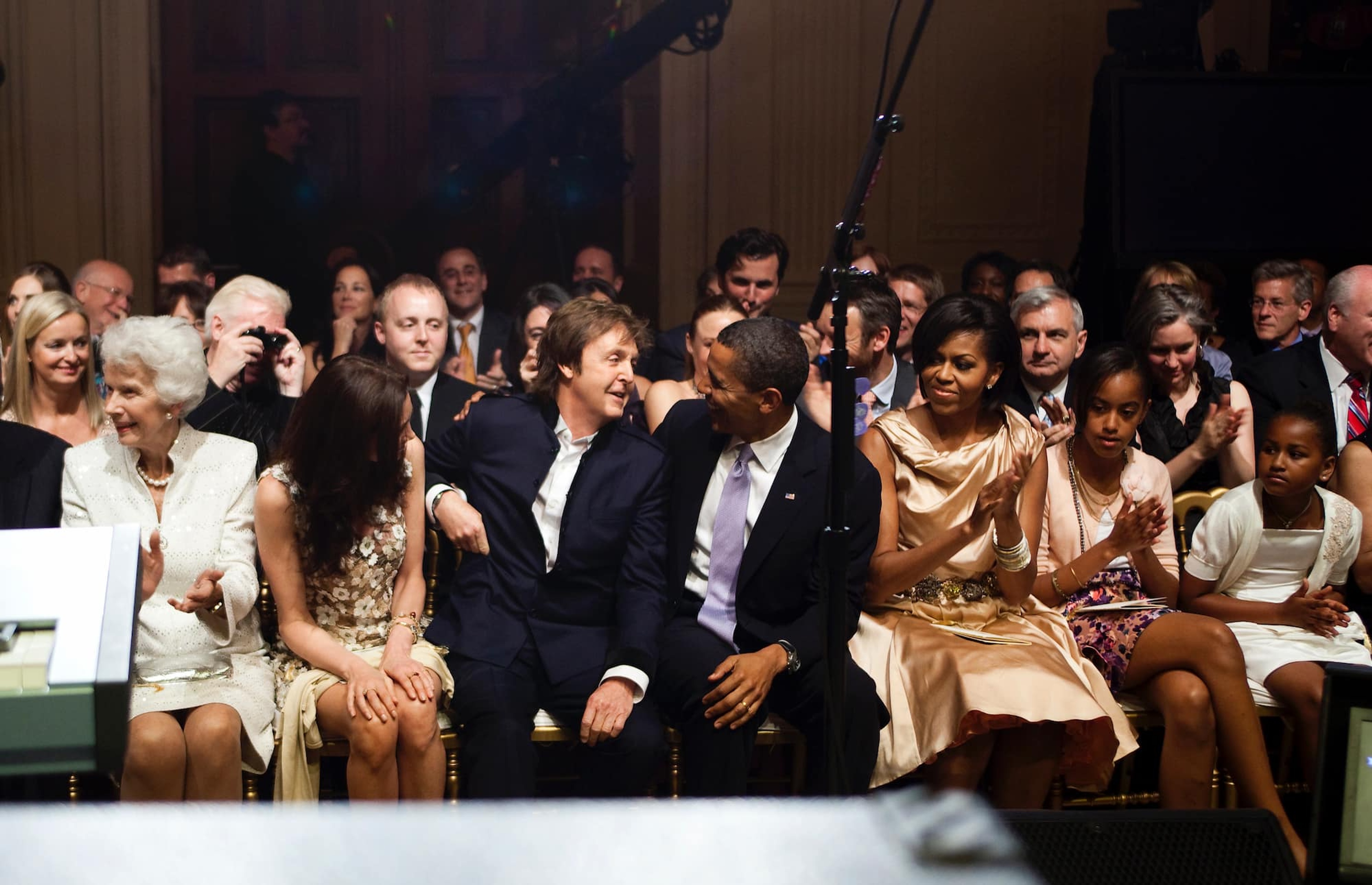 Photo of Nancy, Paul with Barack, Michelle, Malia and Sasha Obama.