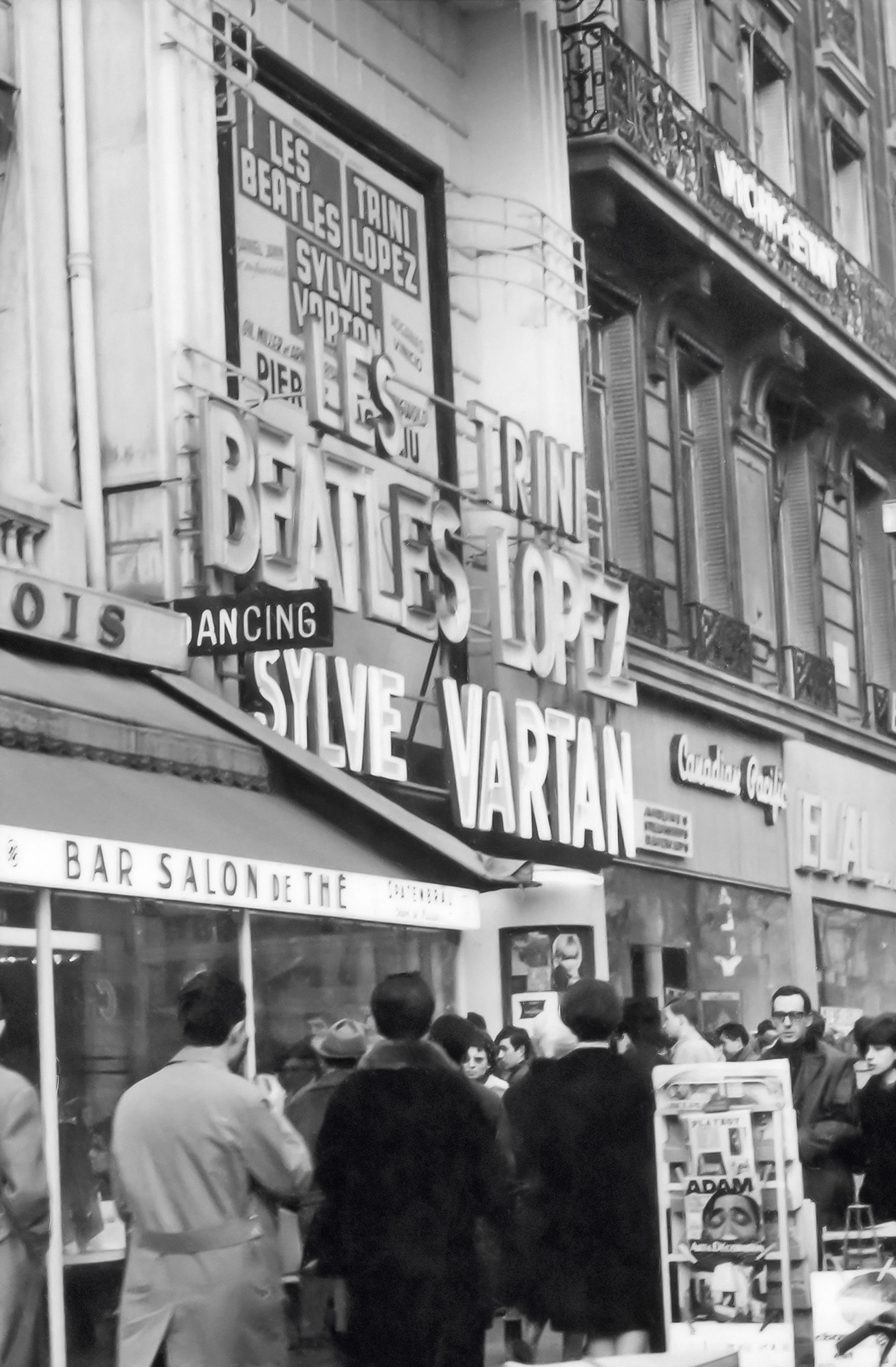 Black and white photograph of a sign outside l'Olympia theatre in Paris saying Les Beatles