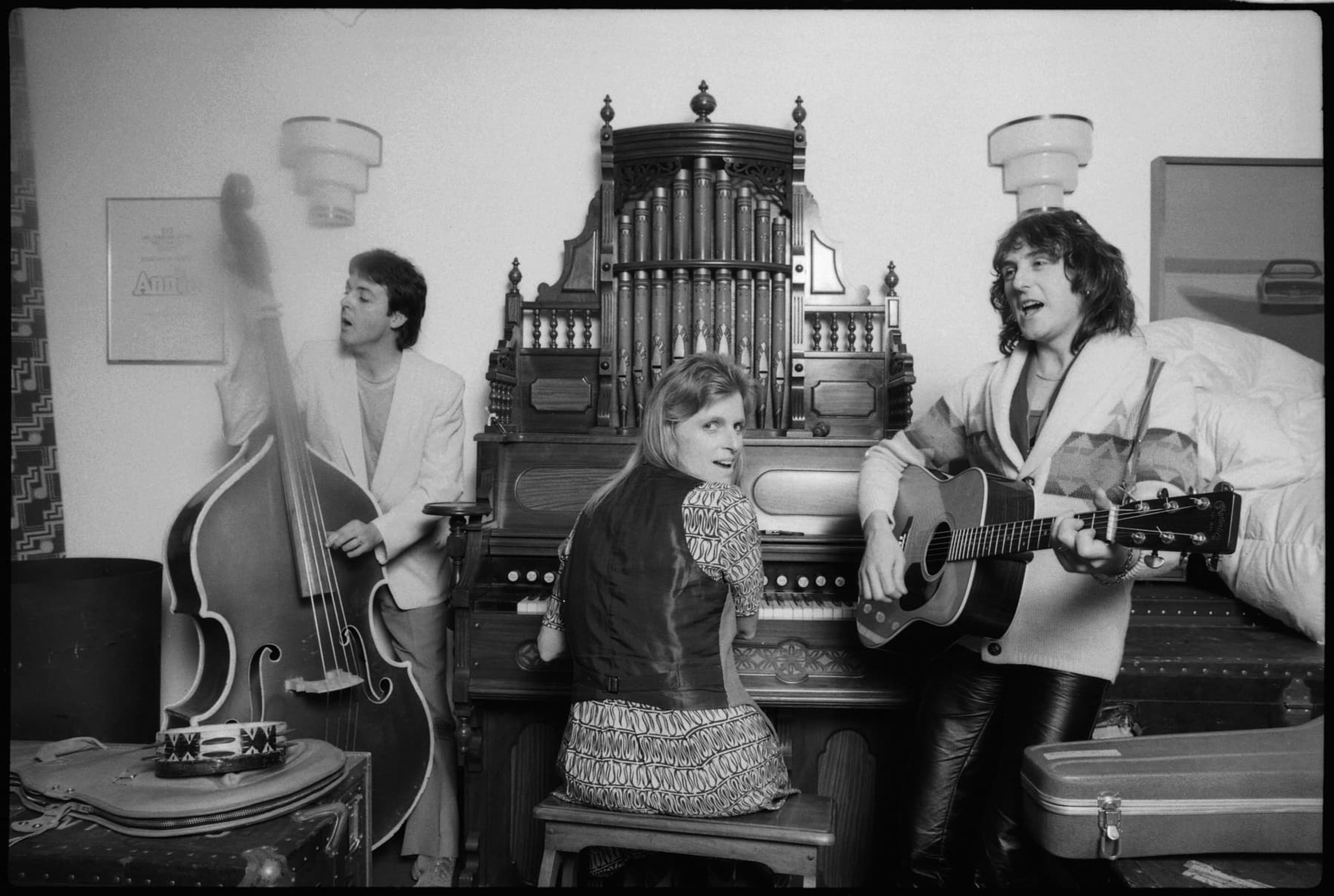 Paul, Linda, and Denny Laine playing instruments