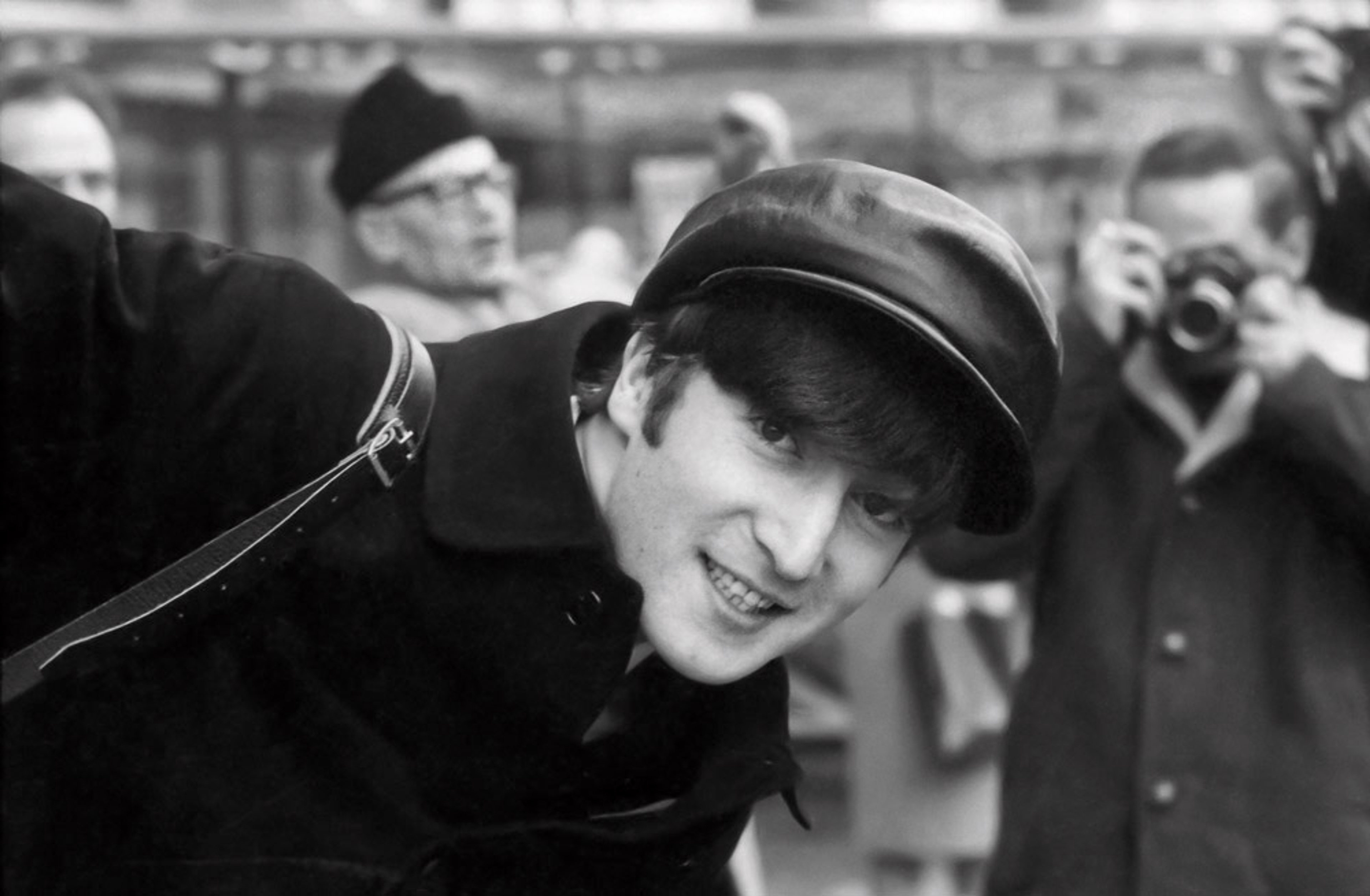 Black and white photograph of John Lennon in Paris taken by Paul McCartney