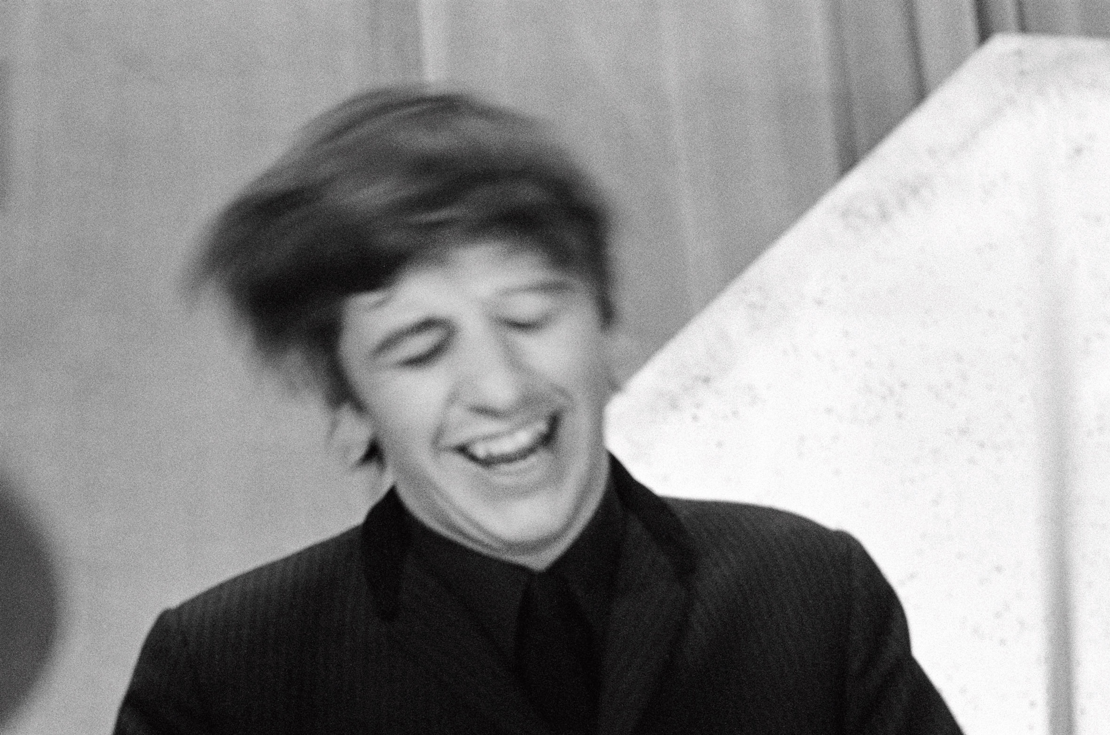 Black and white photograph of Ringo performing in London