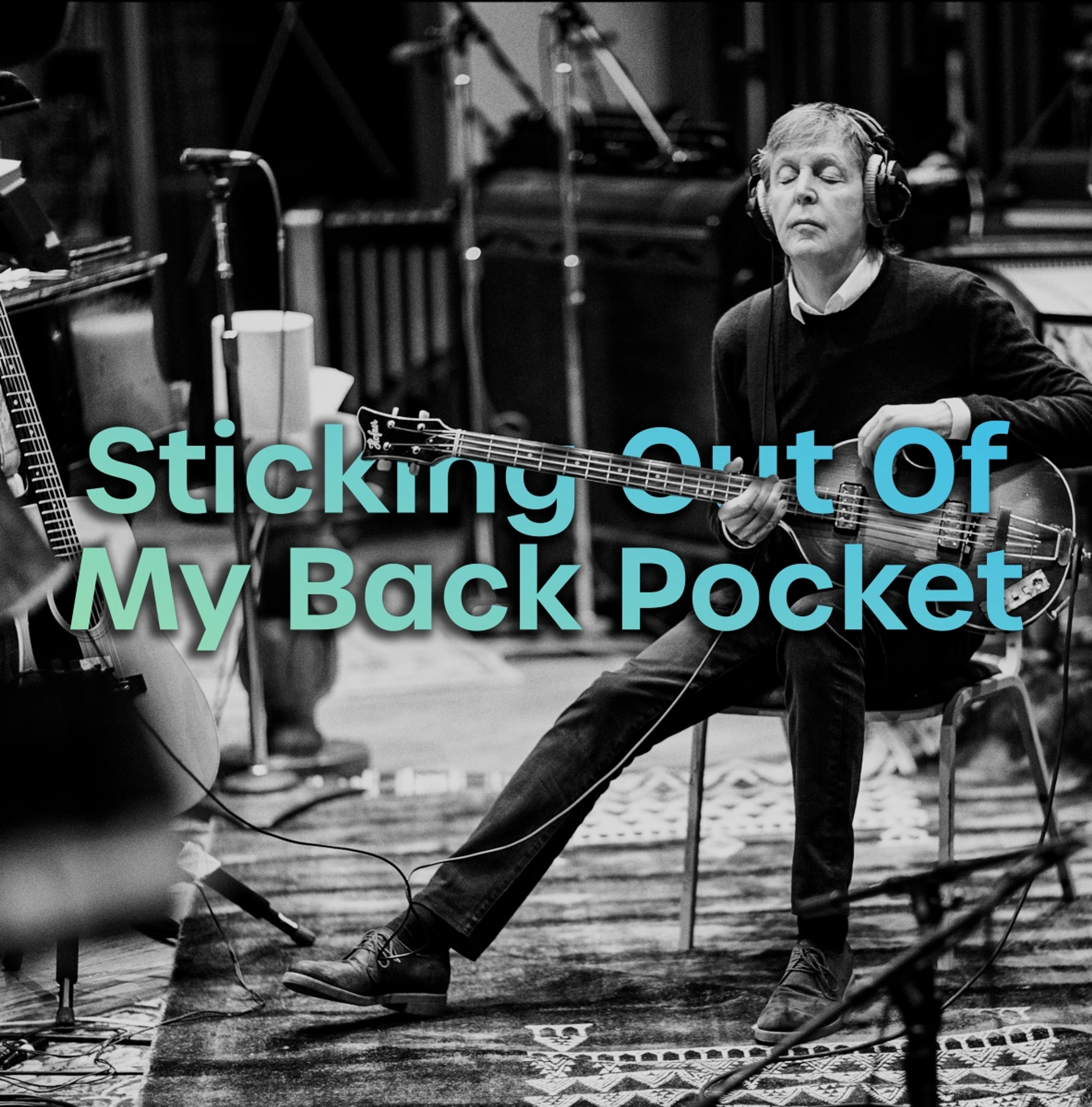 Photo of Paul playing bass used for the July 2021 cover of the Sticking Out Of My Back Pocket playlist