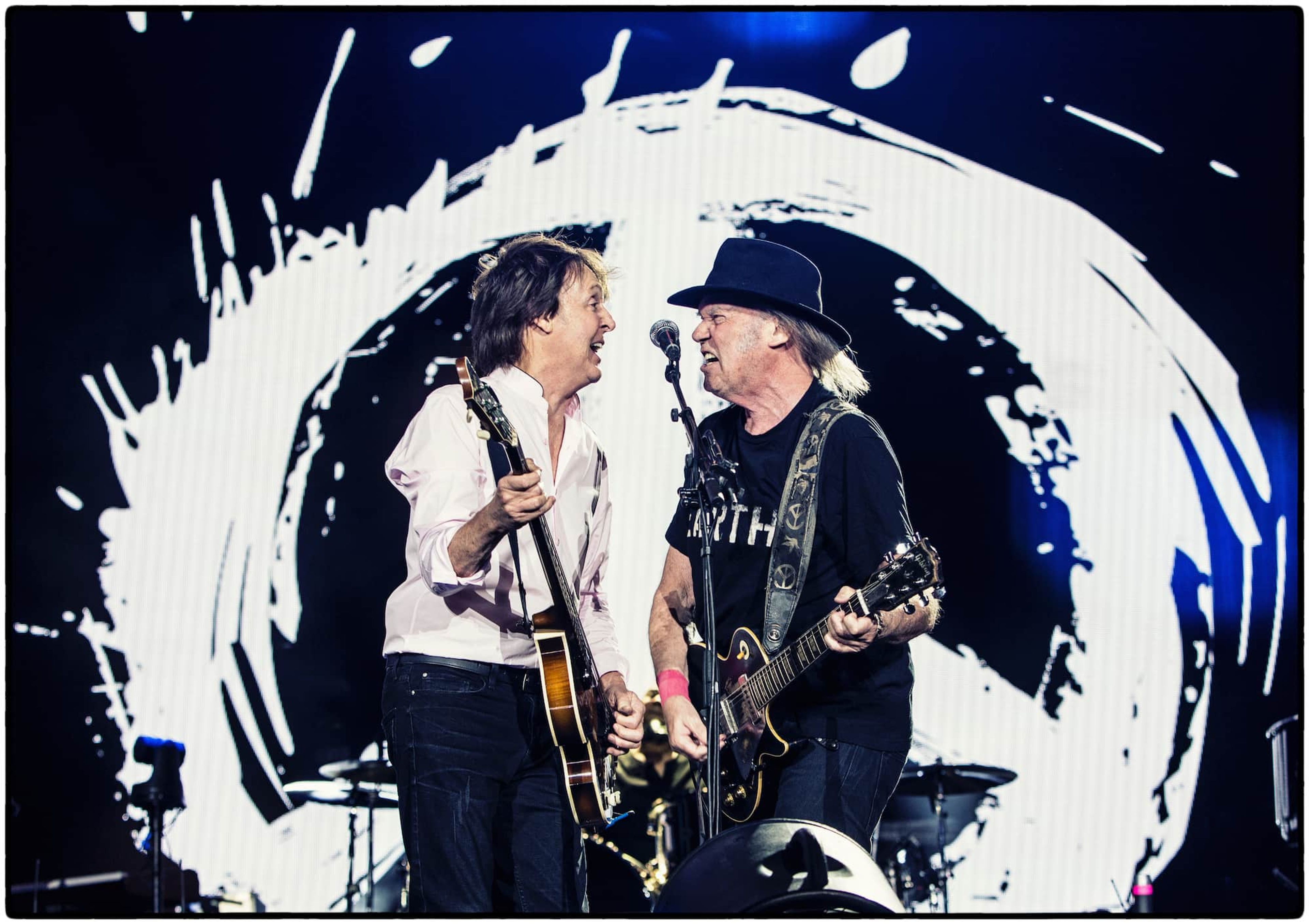 Photo of Paul and Neil Young at Desert Trip in 2016