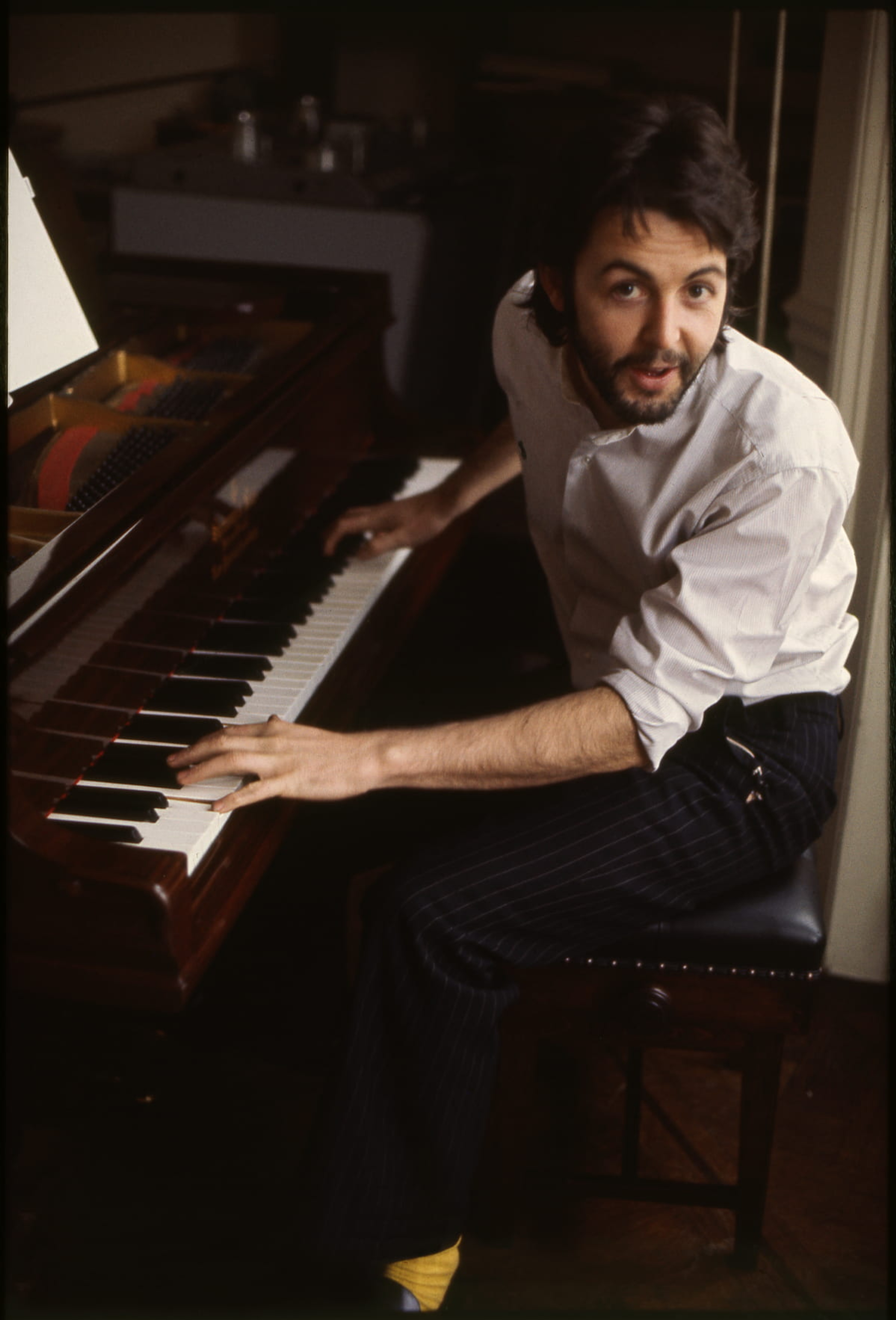 Photo of Paul playing piano at home.