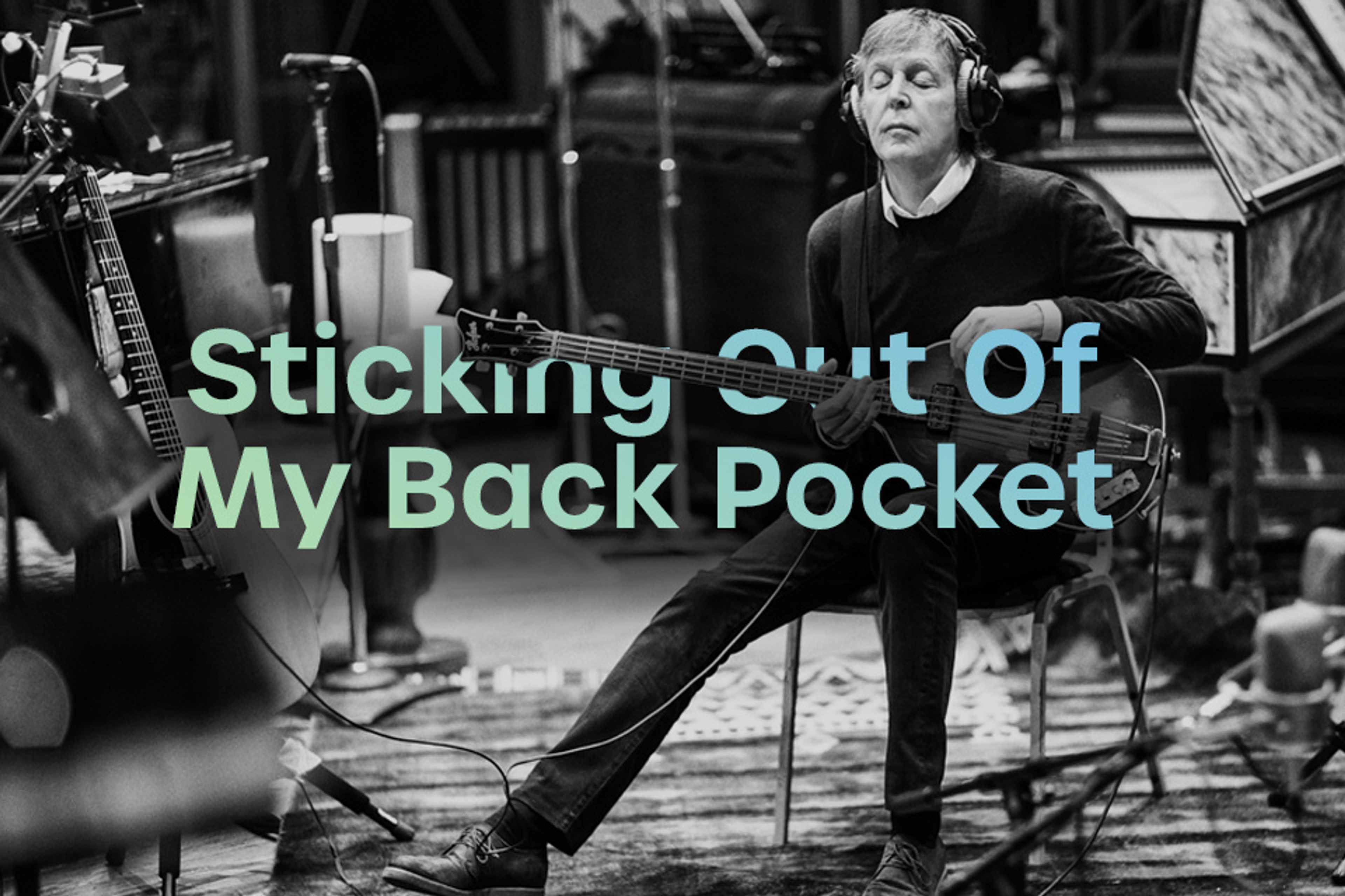 Photo of Paul playing bass used for the July 2021 cover of the Sticking Out Of My Back Pocket playlist