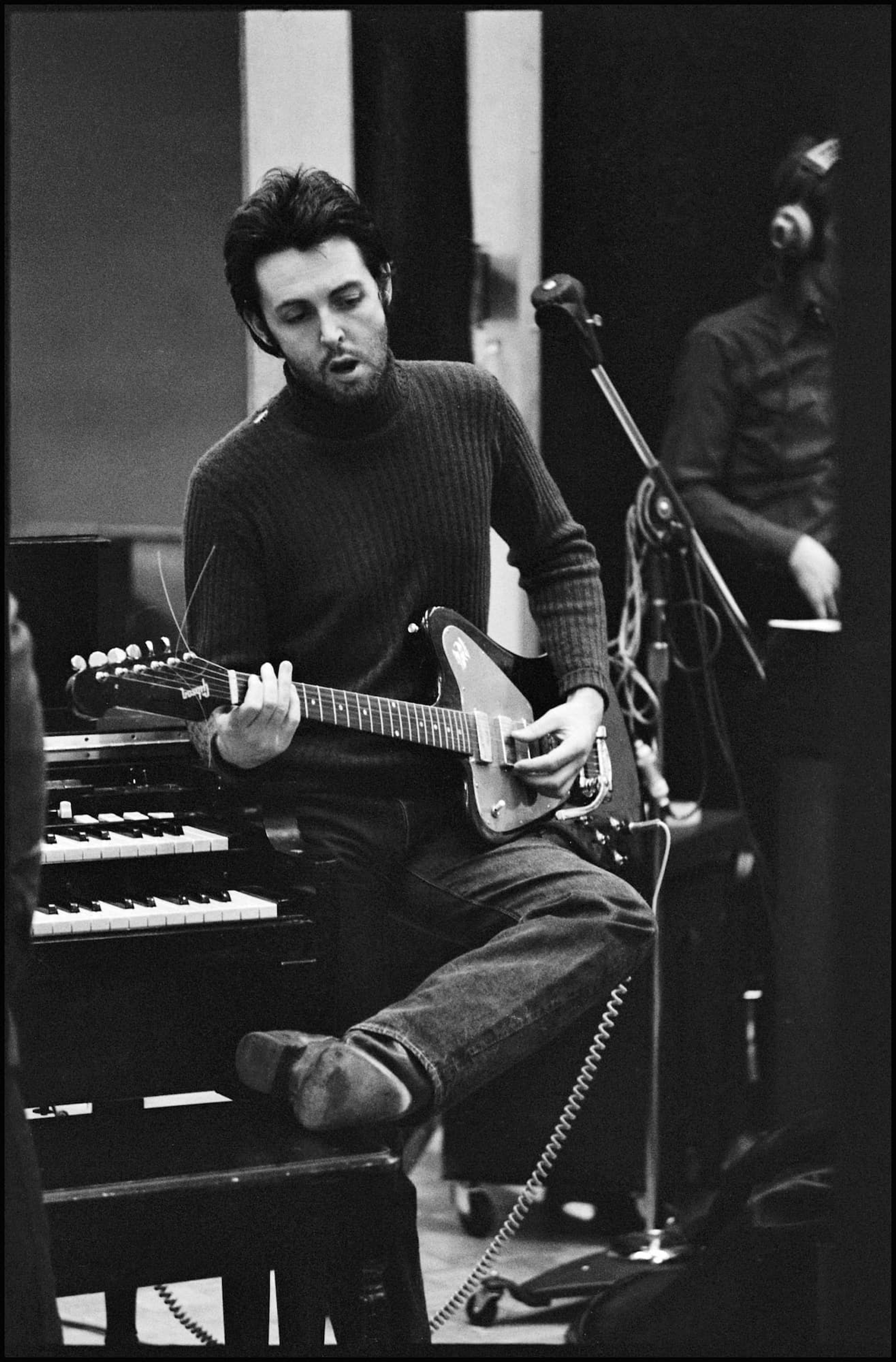 Black and White photo of Paul playing guitar recording RAM