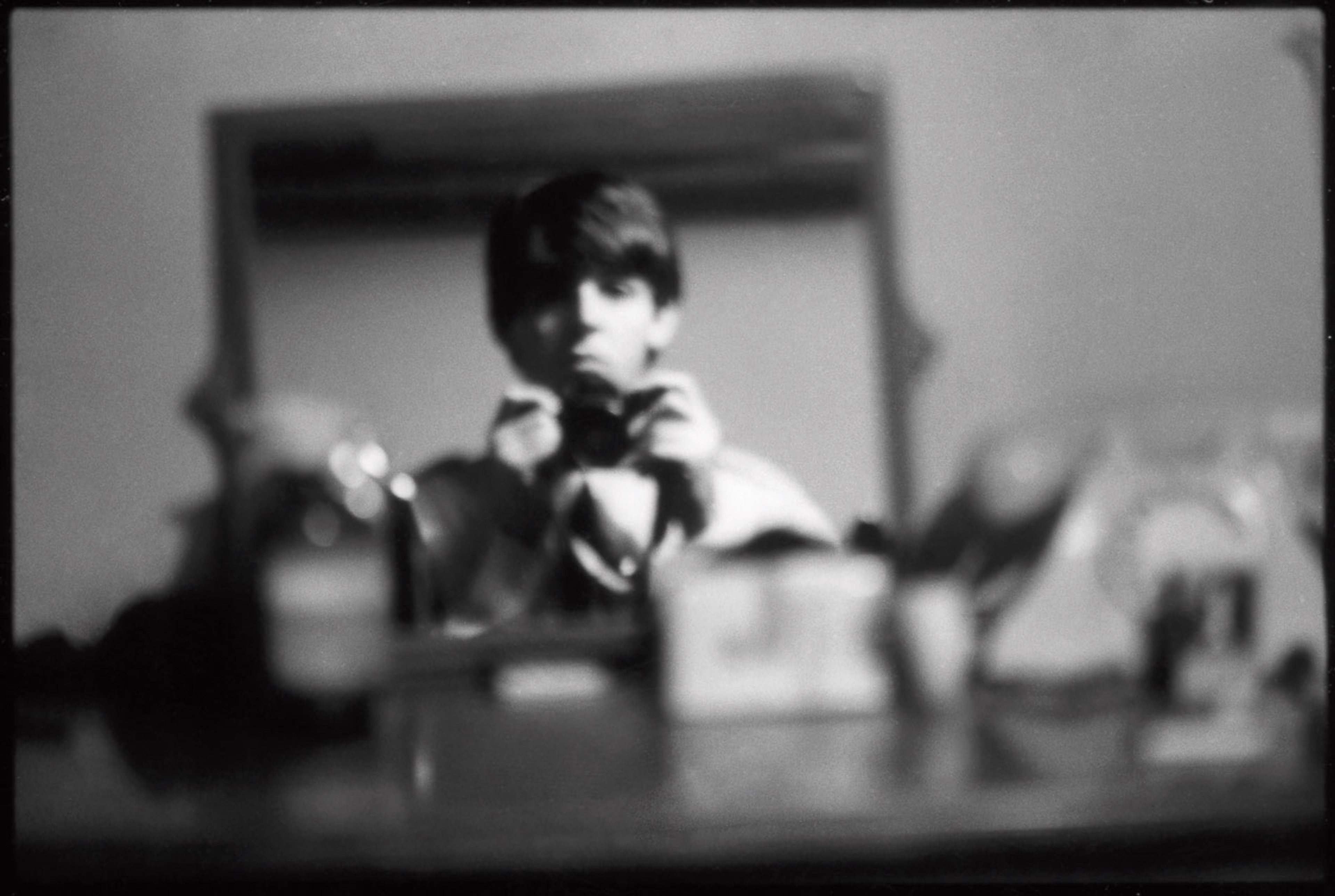Black and white self-portrait photograph of Paul McCartney in London taken in the early sixties