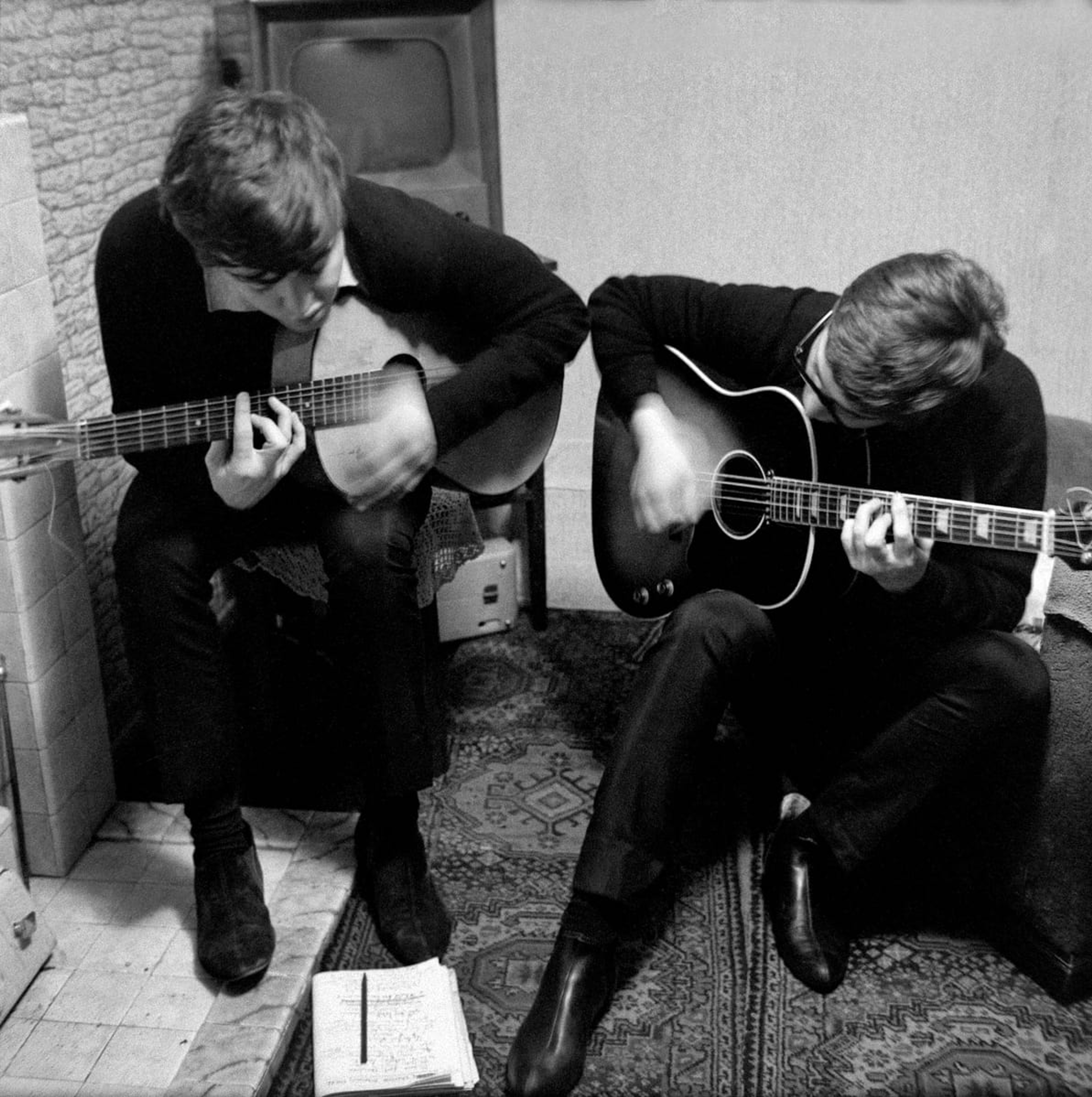 Paul with John Lennon writing 'I Saw Her Standing There' in Paul's childhood home. Liverpool, 1962